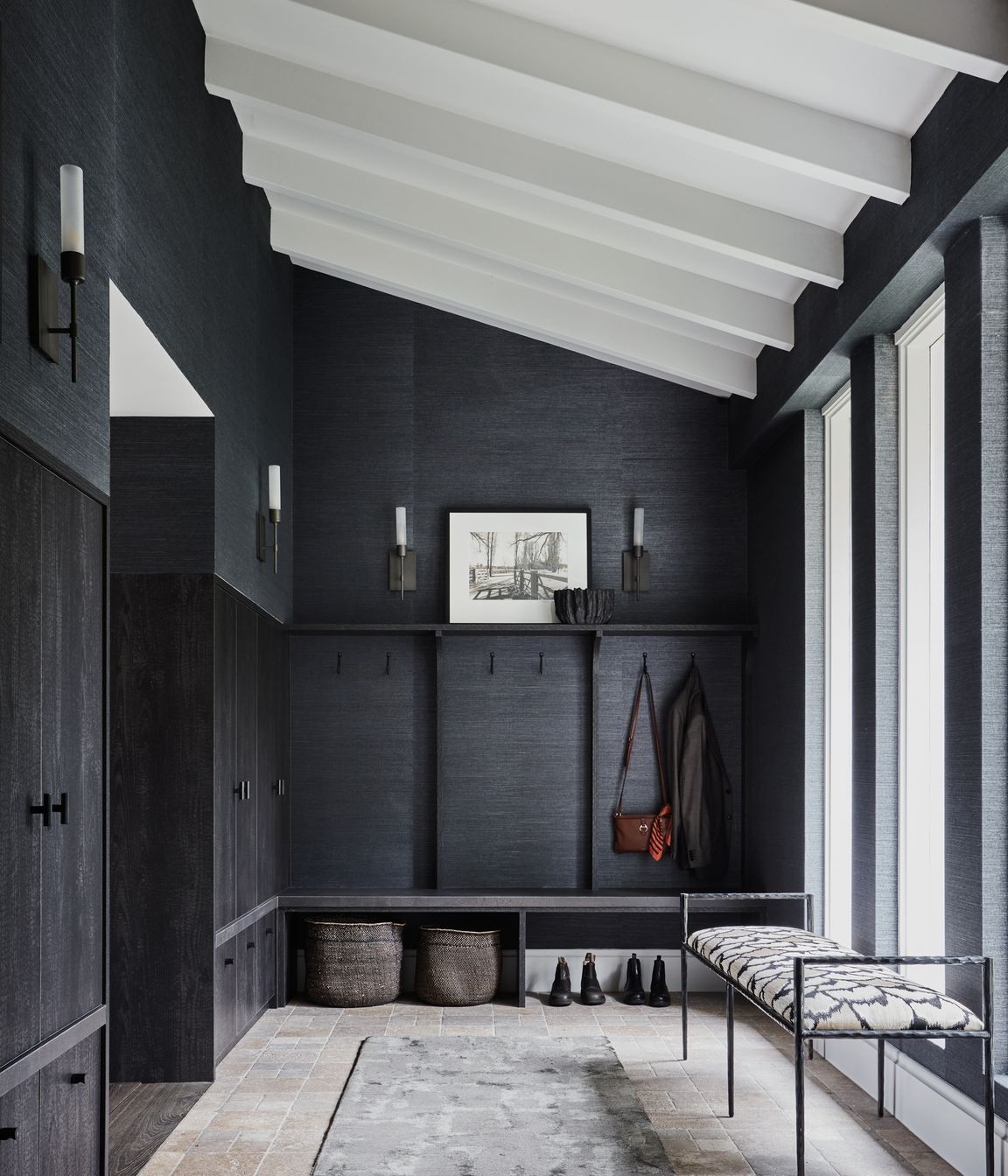 FOYER Phillip Jeffries ‘Manila Hemp’ wallpaper in Charcoal, The Textile Company. Torno wall lights, Blueprint Lighting. Sydney wall hooks, Hepburn Hardware. Berliner runner, Robyn Cosgrove. Arteriors ‘Barbana’ bench, Boyd Blue. Dark travertine cobbles, Aeria Country Floors.