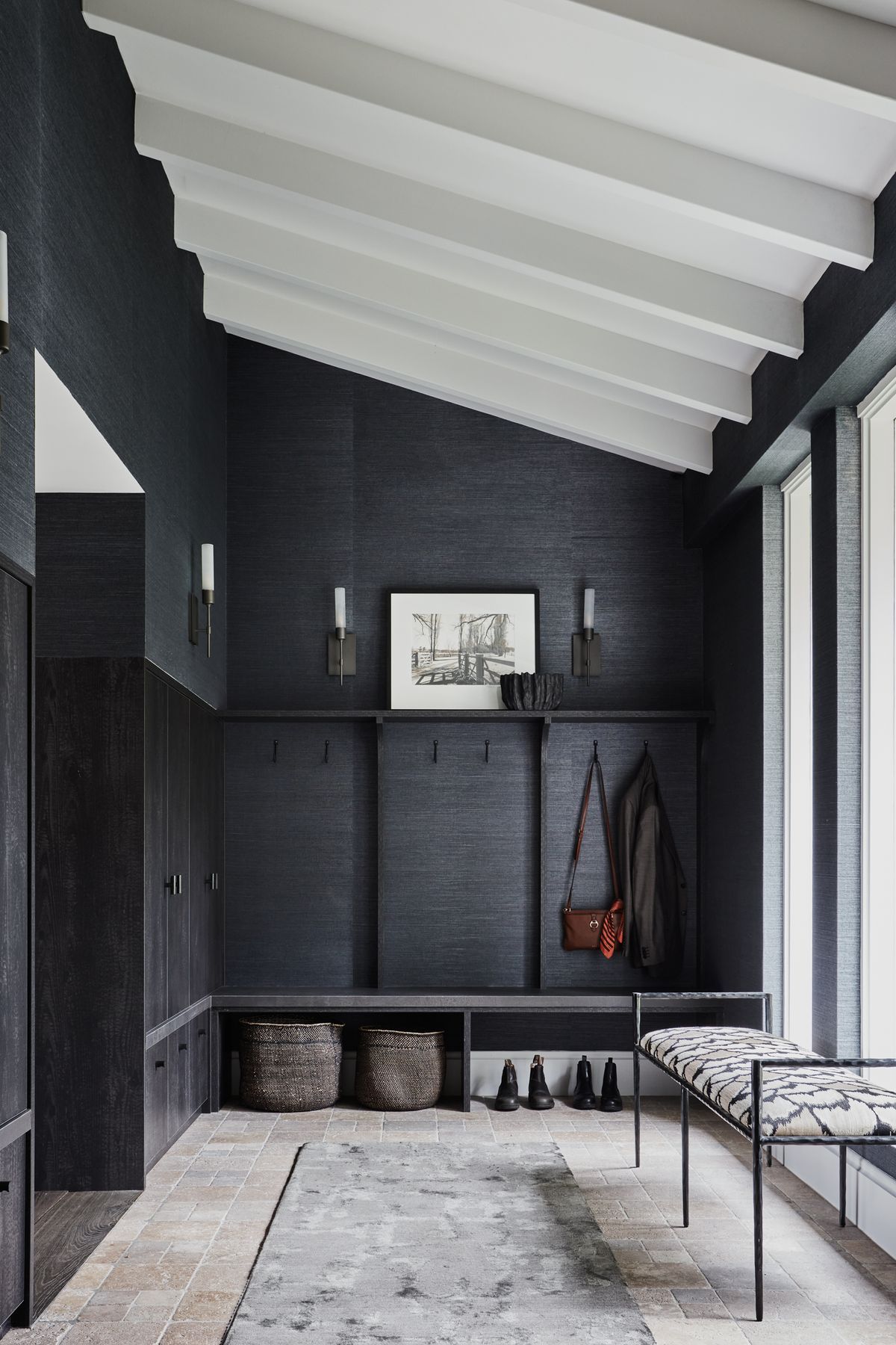 FOYER Phillip Jeffries ‘Manila Hemp’ wallpaper in Charcoal, The Textile Company. Torno wall lights, Blueprint Lighting. Sydney wall hooks, Hepburn Hardware. Berliner runner, Robyn Cosgrove. Arteriors ‘Barbana’ bench, Boyd Blue. Dark travertine cobbles, Aeria Country Floors.