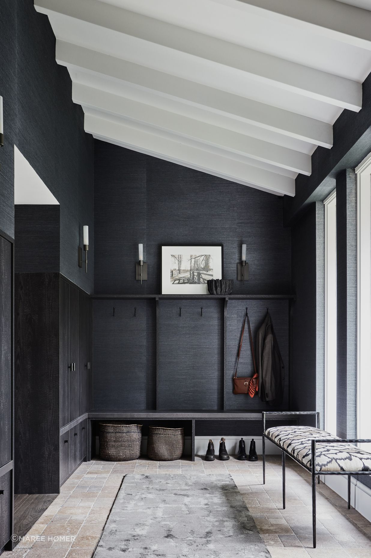 FOYER Phillip Jeffries ‘Manila Hemp’ wallpaper in Charcoal, The Textile Company. Torno wall lights, Blueprint Lighting. Sydney wall hooks, Hepburn Hardware. Berliner runner, Robyn Cosgrove. Arteriors ‘Barbana’ bench, Boyd Blue. Dark travertine cobbles, Aeria Country Floors.