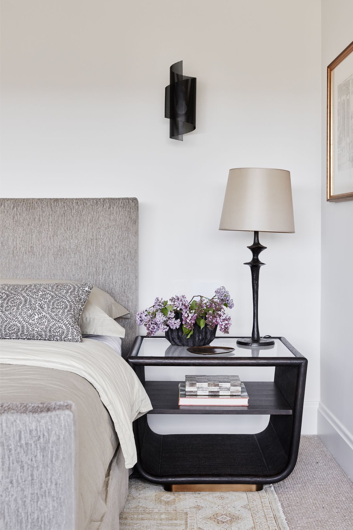 MAIN BEDROOM Spun Tulle wall sconce, Blueprint Lighting, NYC. Table lamp, Objet Insolite. McGuire Ladera side table, Studio Cavit. Custom bedhead in Suzanne Tucker ‘Geoffrey’ fabric, Tigger Hall Design. Busatti bedlinen, Kate Nixon.