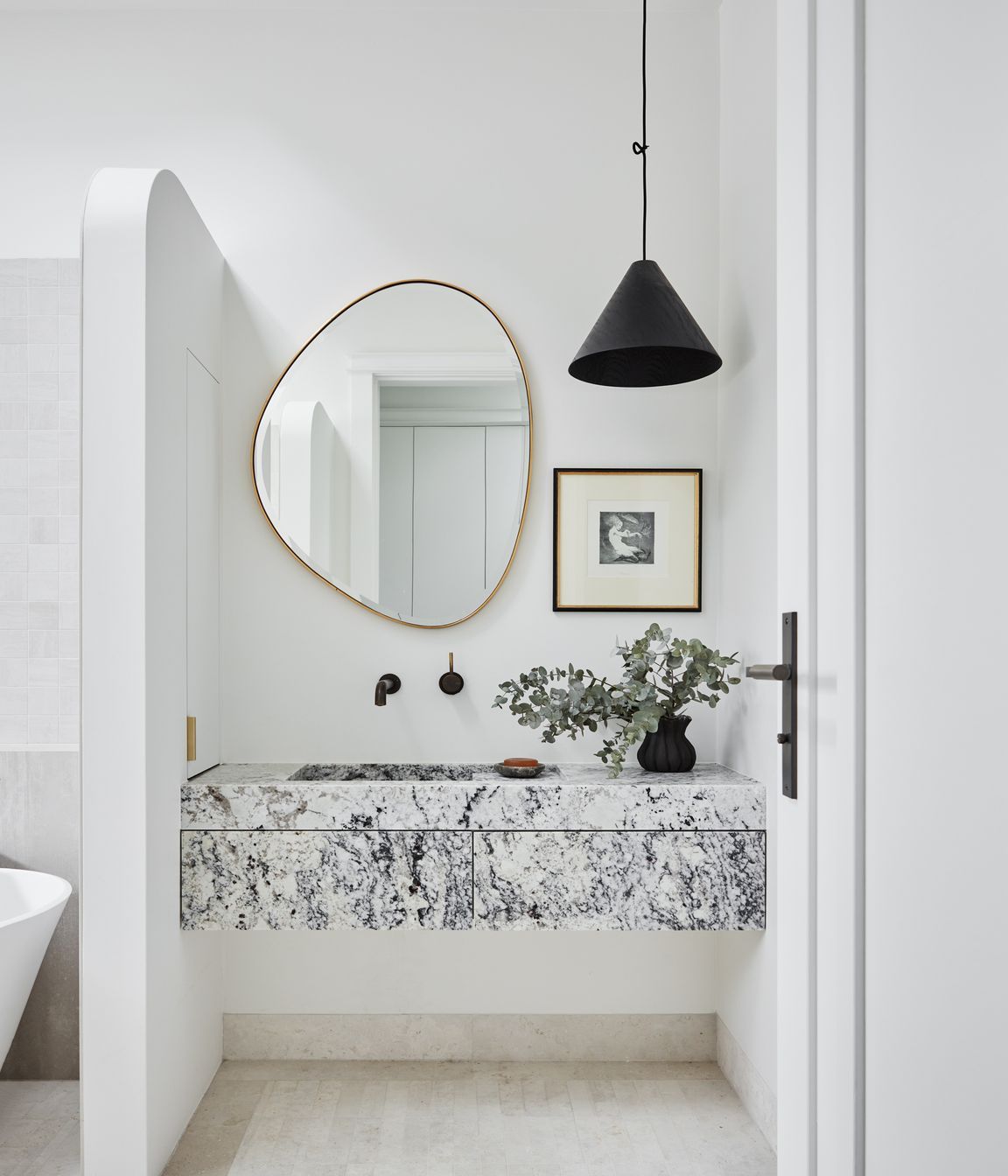 MAIN BATHROOM Summit 330 pendant light, About Space. Pebble mirror, Life Interiors. White granite vanity, Granite &amp; Marble Works. Brodware ‘City Stik’ wall mixer, Sydney Tap and Bathroomware. Limestone floor tiles, Onsite Supply+Design. Boost wall tiles, Rocks On.