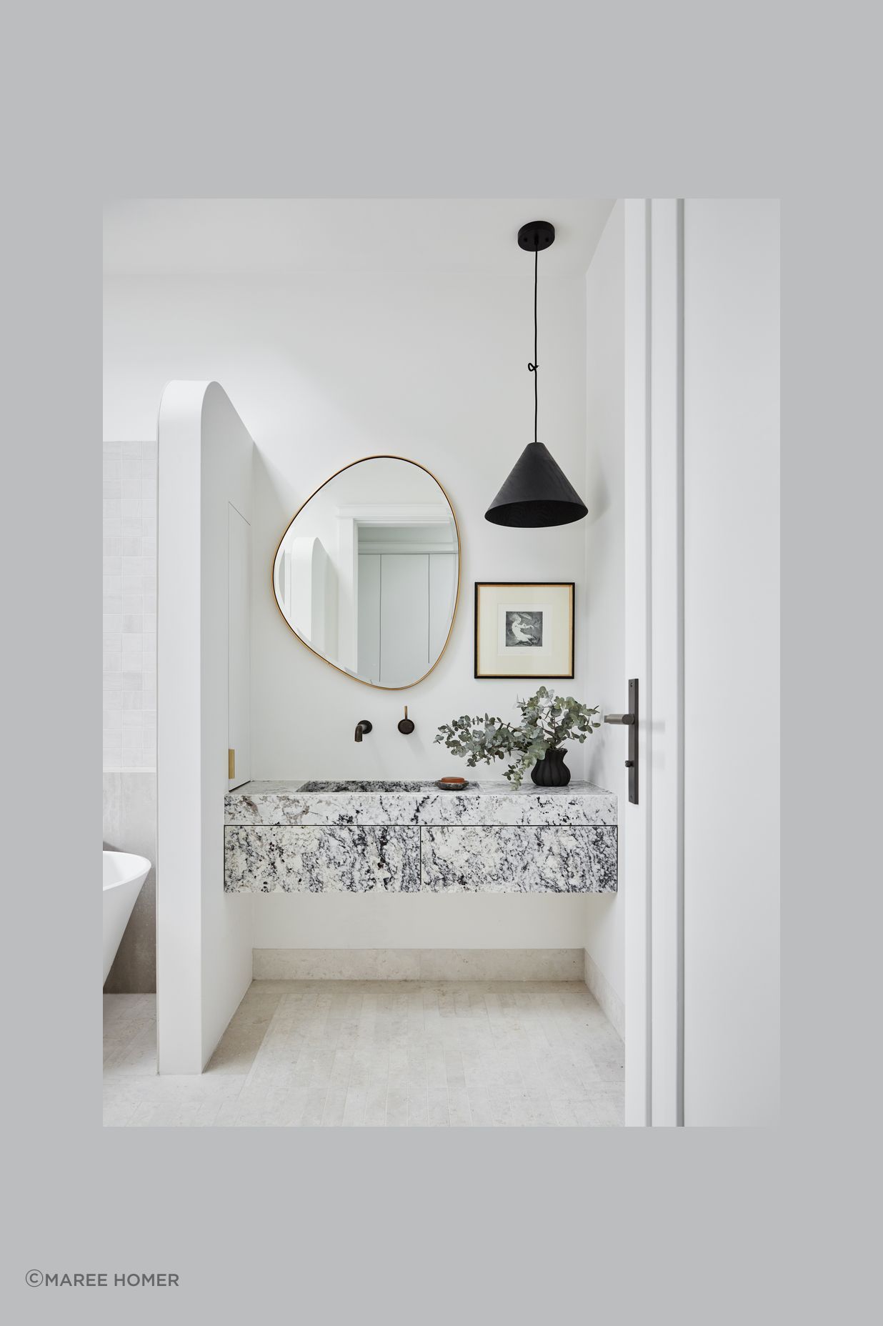 MAIN BATHROOM Summit 330 pendant light, About Space. Pebble mirror, Life Interiors. White granite vanity, Granite & Marble Works. Brodware ‘City Stik’ wall mixer, Sydney Tap and Bathroomware. Limestone floor tiles, Onsite Supply+Design. Boost wall tiles, Rocks On.