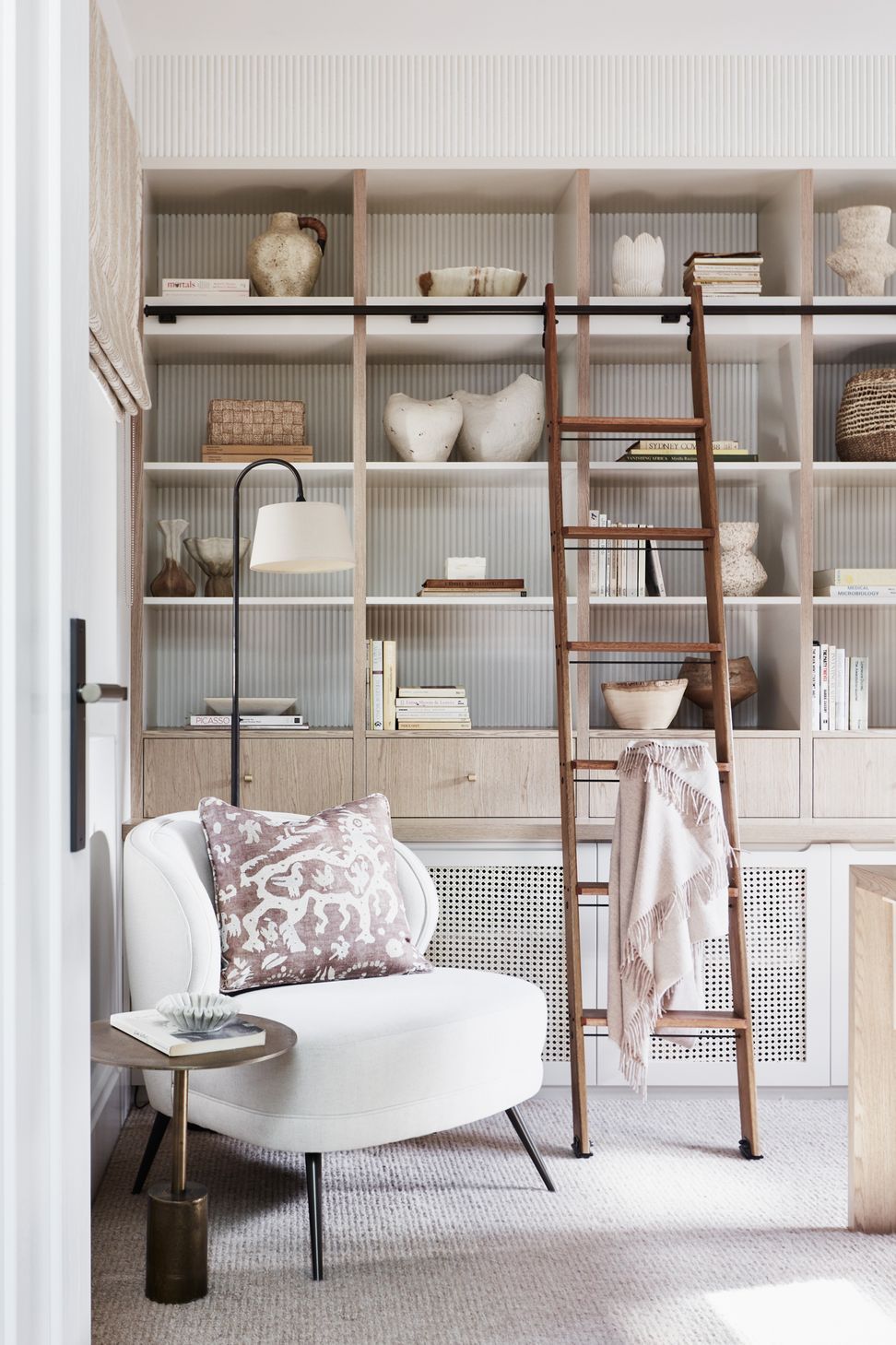 STUDY Library ladder, Ladder Central. Floor lamp, existing. Arteriors ‘Kitts’ armchair, Boyd Blue. Side table, Ideas 4 Lighting. Cushion in Lewis &amp; Wood ‘Iliad’ fabric, Elliott Clarke.