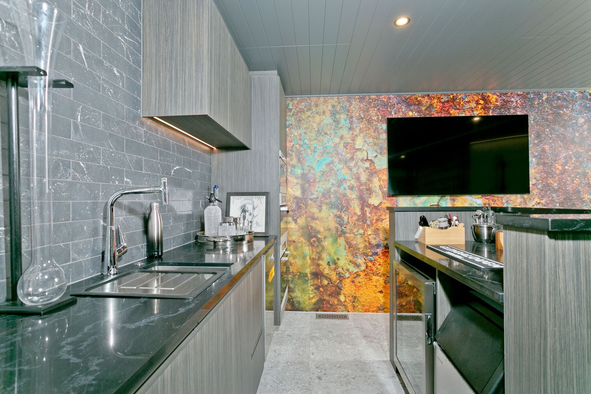 Also leading onto the pool area, the downstairs kitchen has been updated. All of the appliances have been reused from the kitchen upstairs.