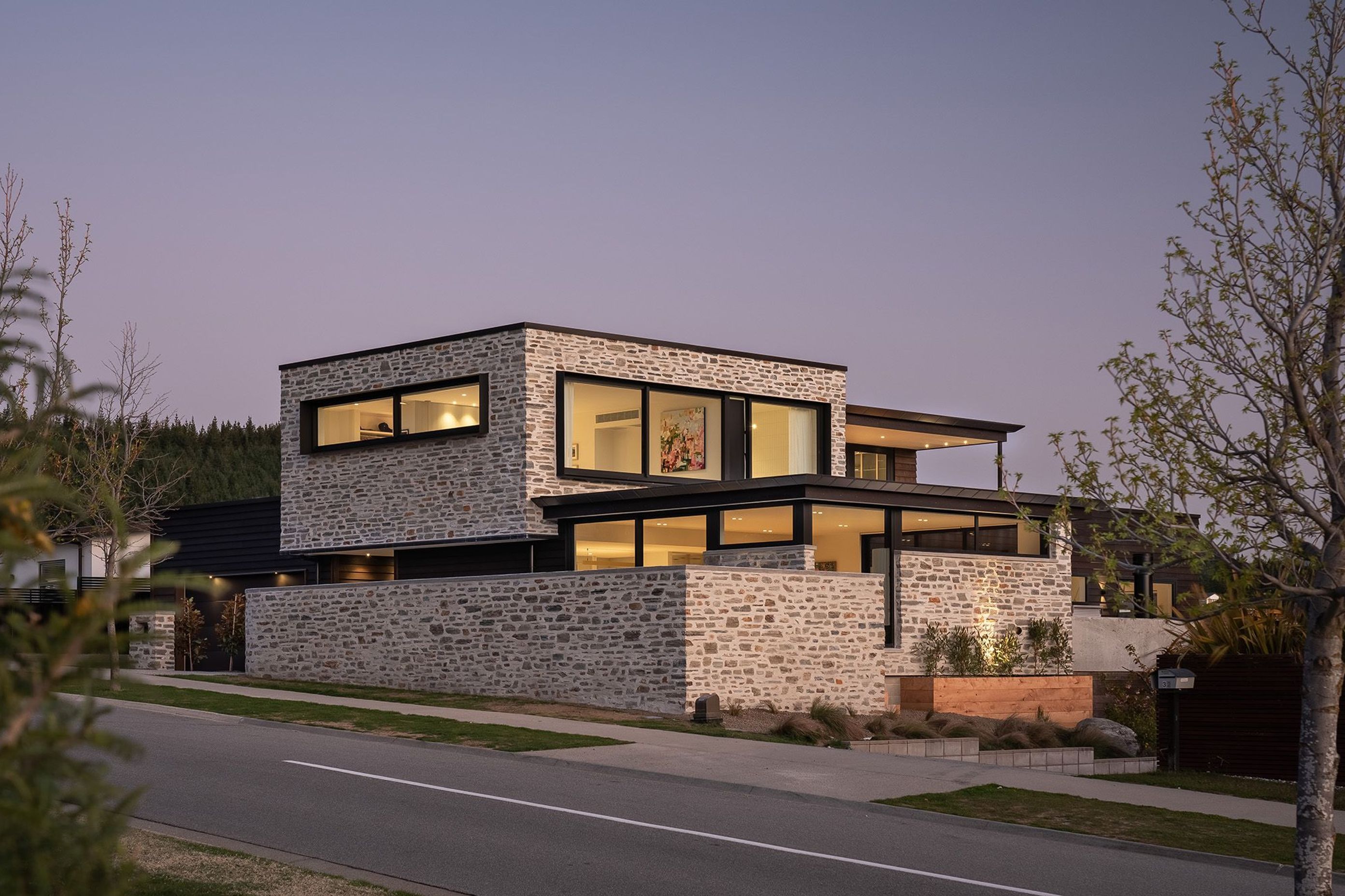 Minaret-RidgerenovationWanaka-exterior-schist-dusk.jpg