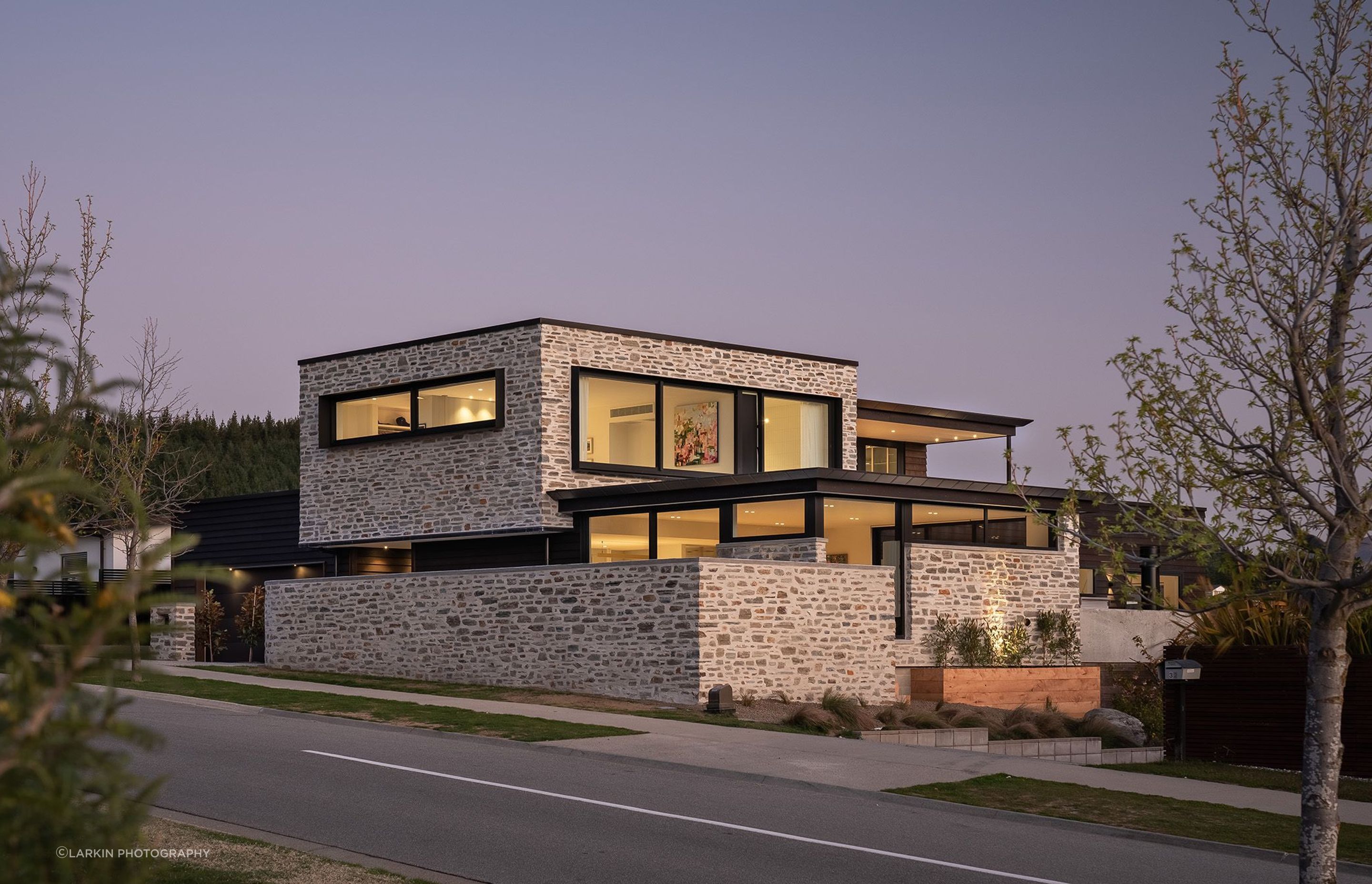 Minaret-RidgerenovationWanaka-exterior-schist-dusk.jpg