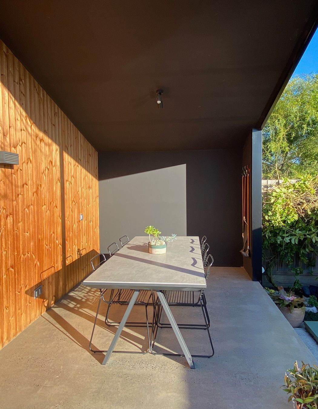 The covered outdoor eating area is perfect for entertaining