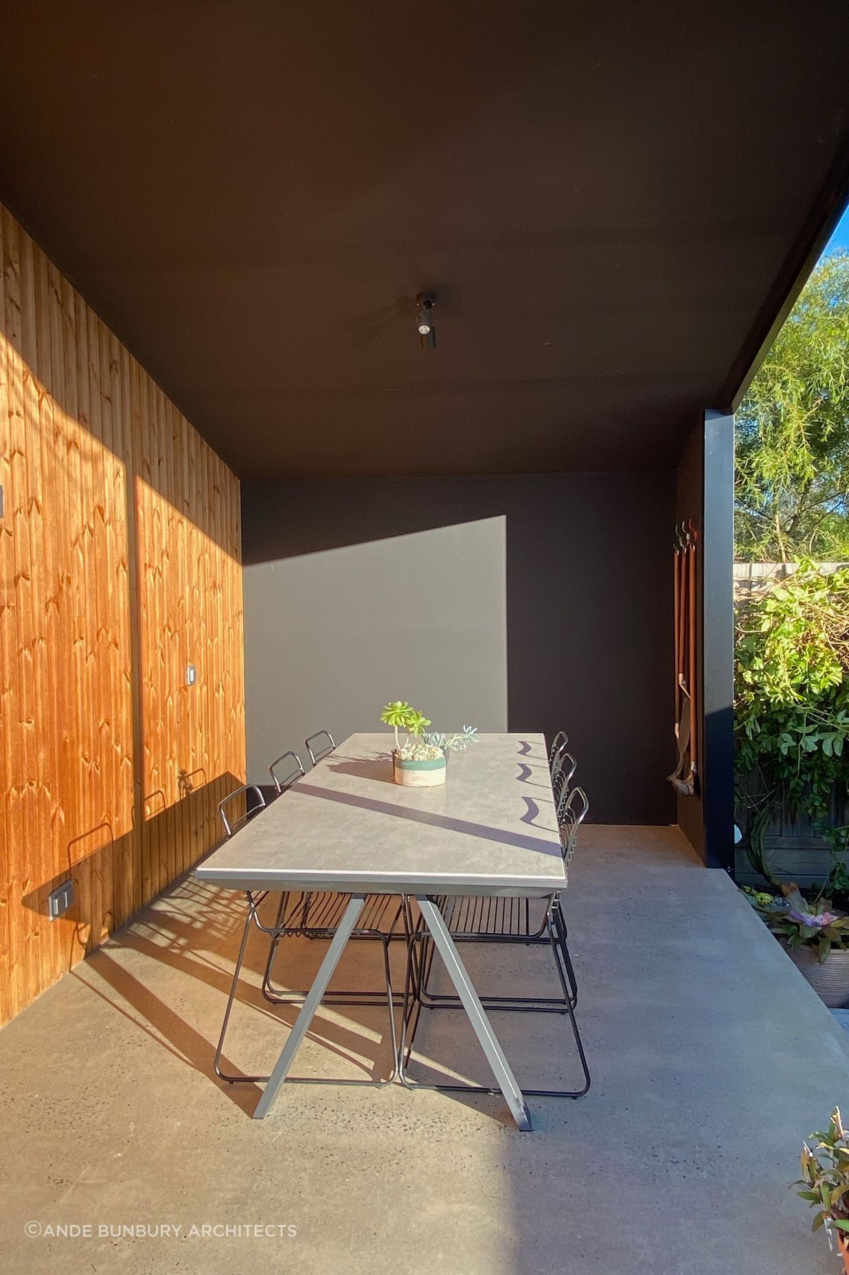 The covered outdoor eating area is perfect for entertaining