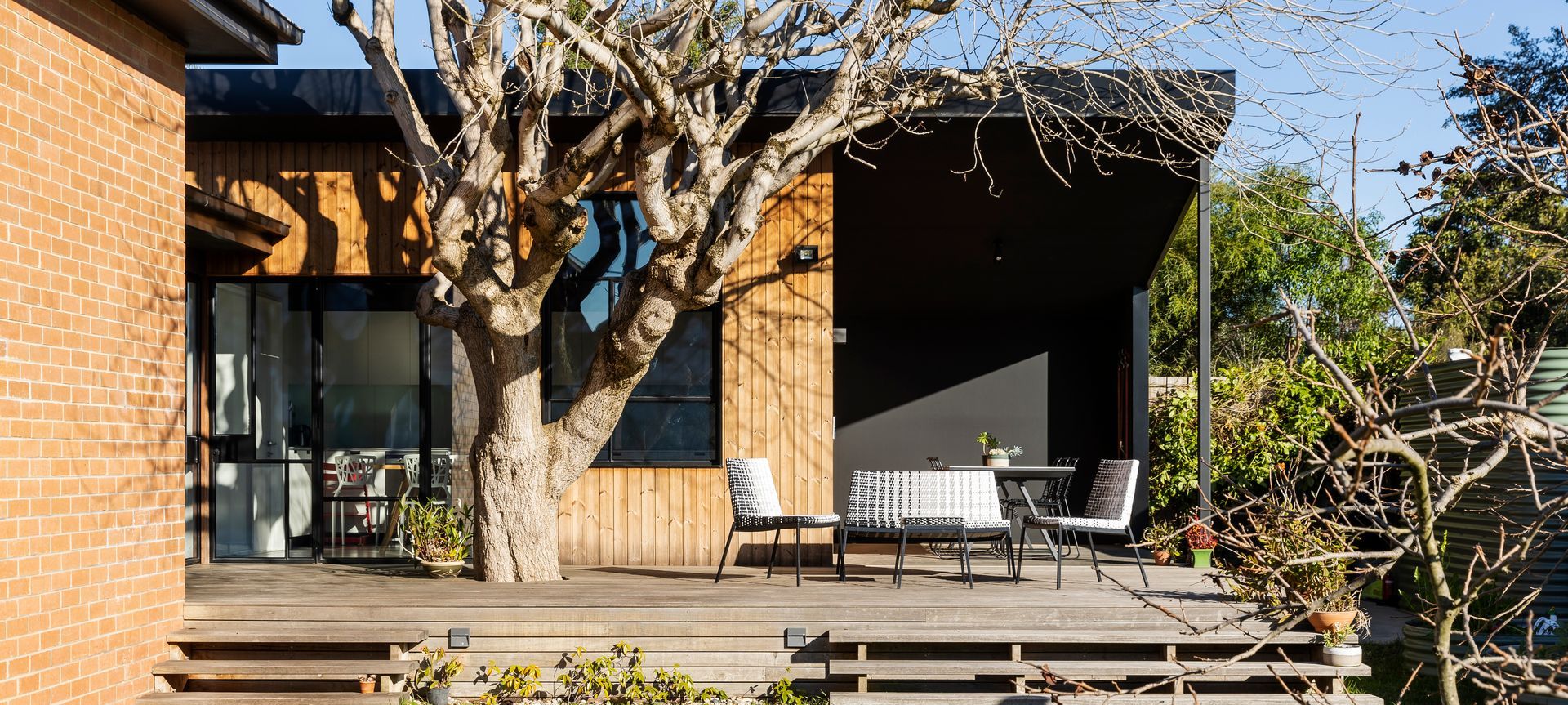 The extension to the house now faces the garden with a sunny outdoor entertaining deck