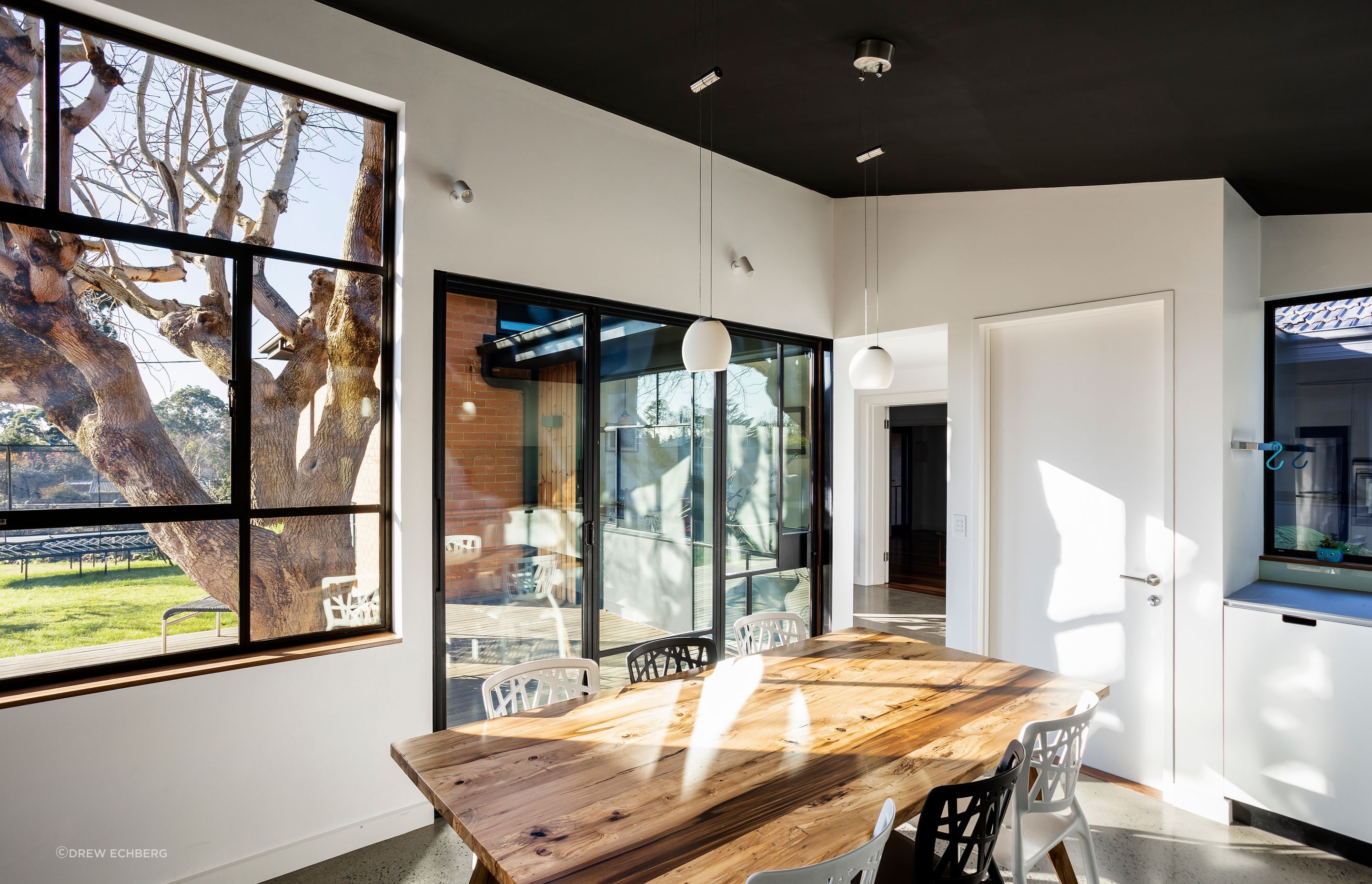 The kitchen now faces the garden and is shaded in summer by the large tree in the deck
