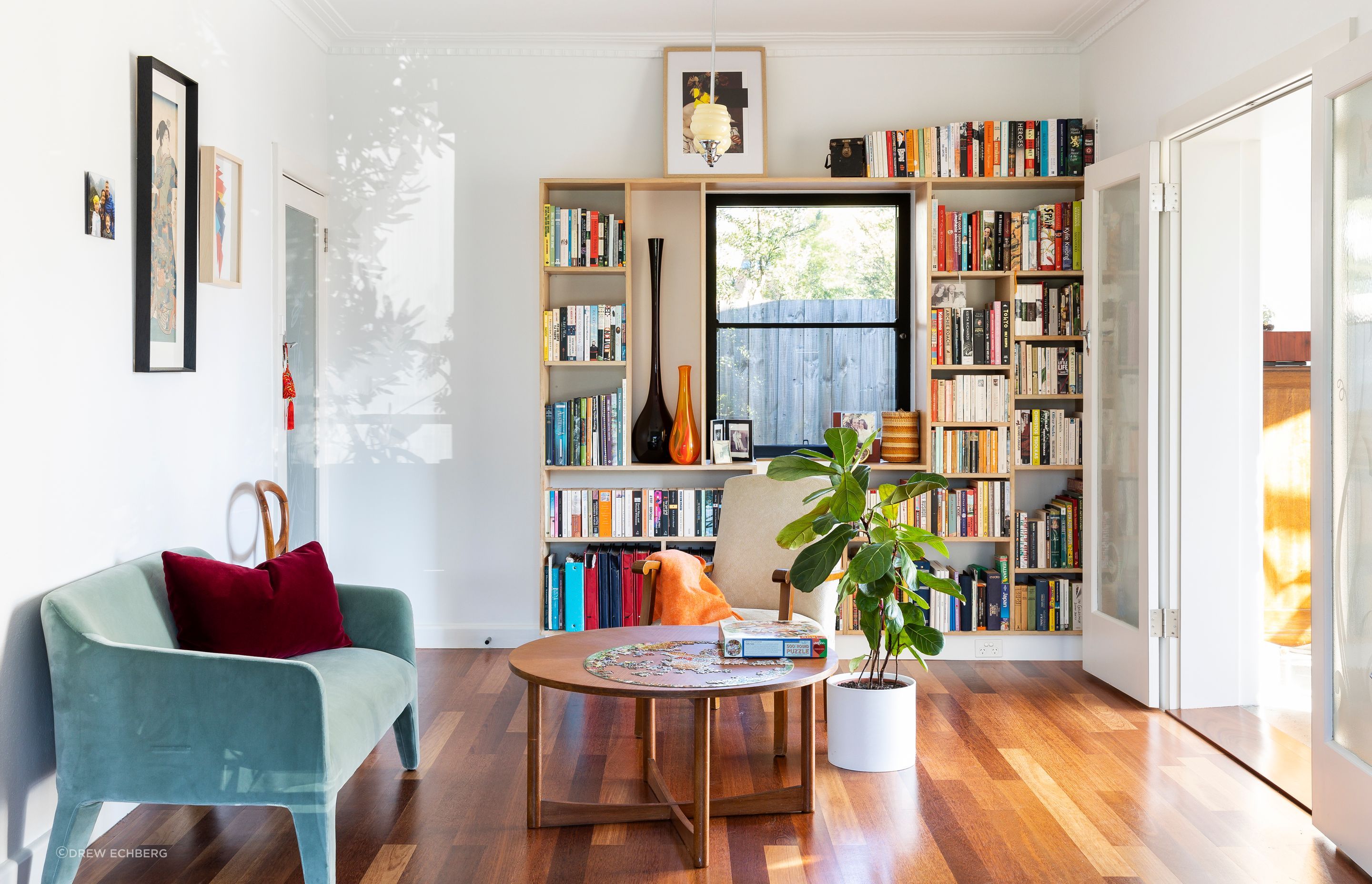 Etched glass doors in a new opening allow light to flood into the formerly dark centre of the house