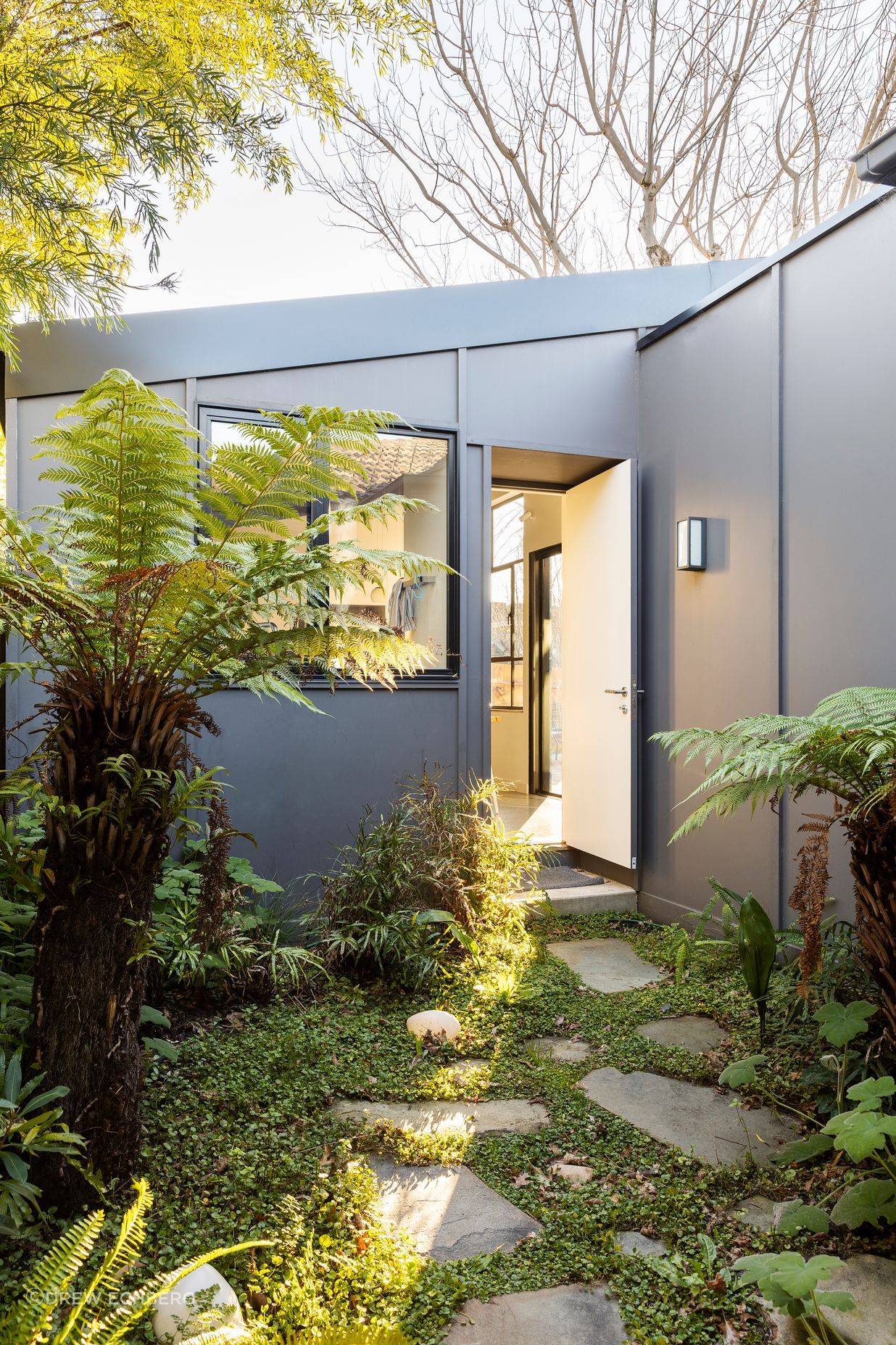 A shady courtyard was created on the south side of the house
