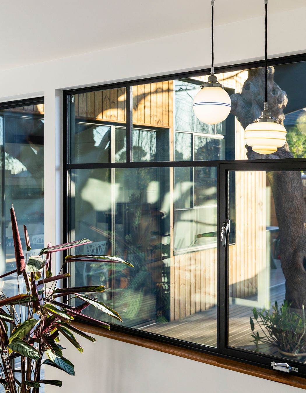 Steel framed windows and recycled pendant lights