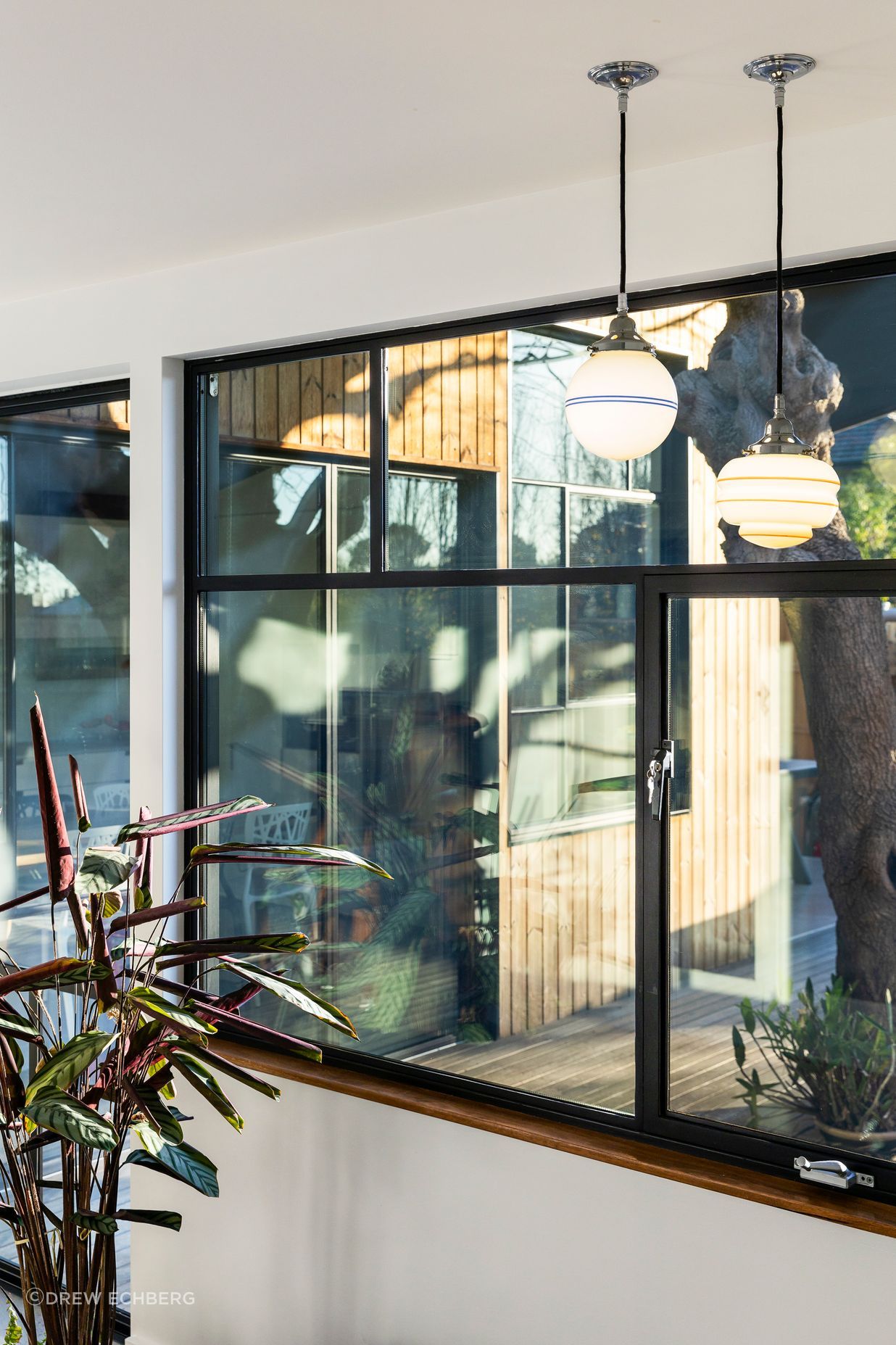Steel framed windows and recycled pendant lights