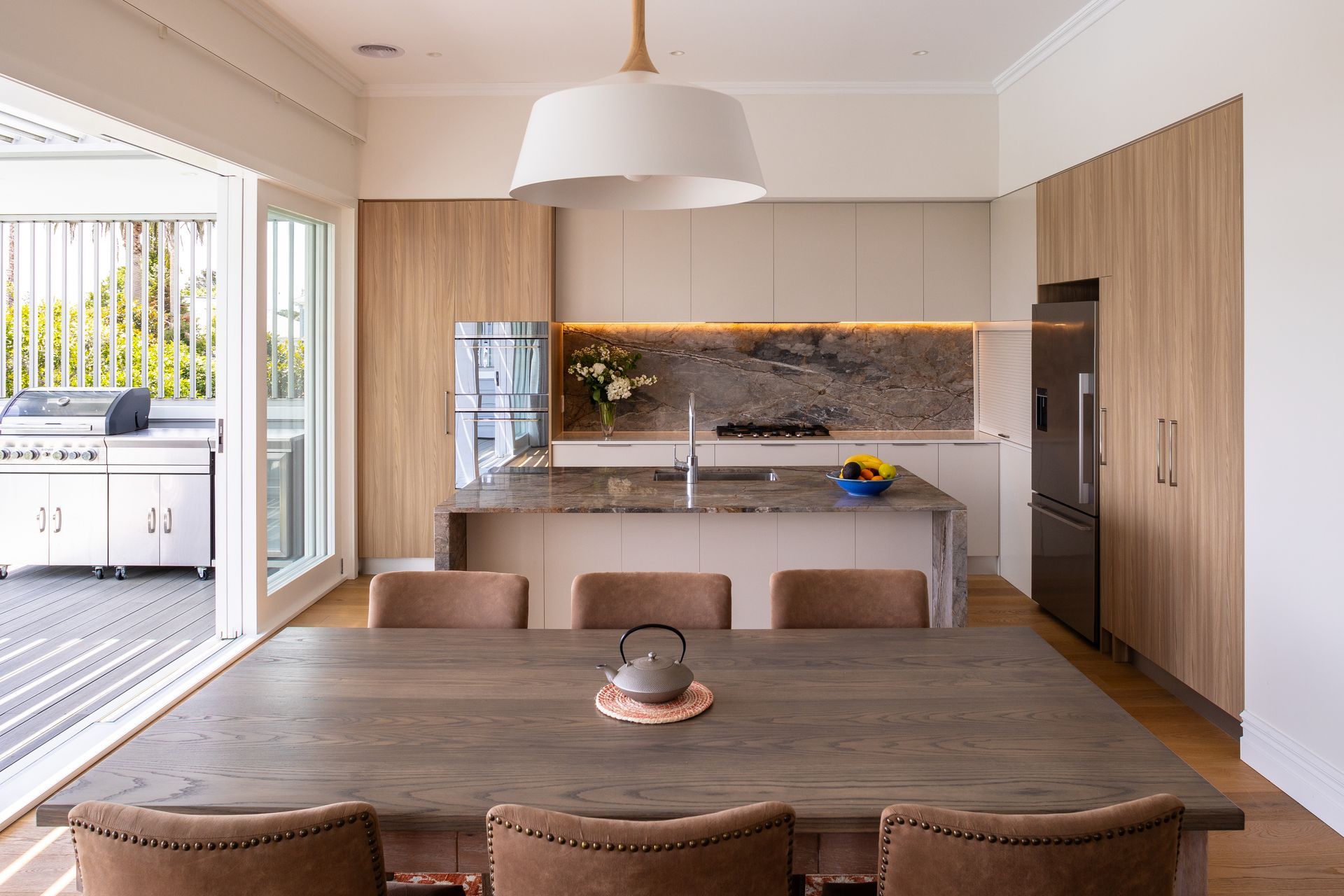 Warm tones are a feature of the new kitchen which provides easy access to the new covered deck and built in barbecue.