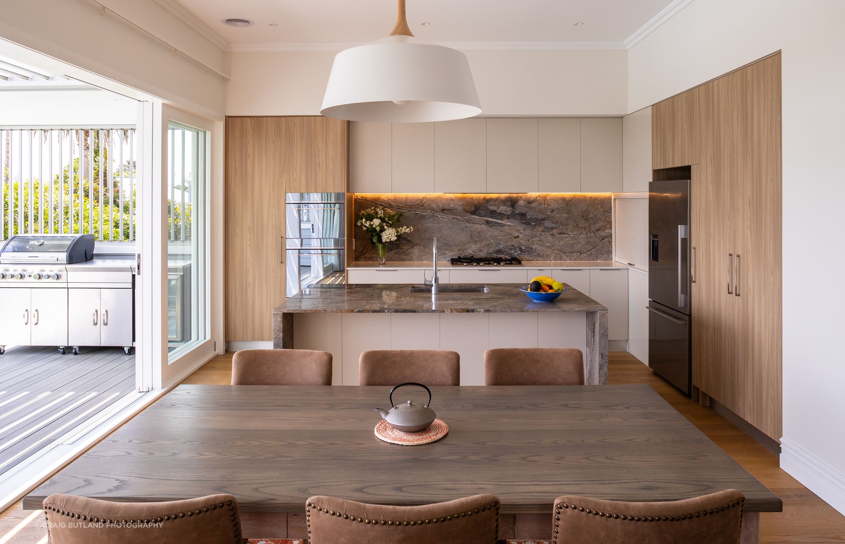 Warm tones are a feature of the new kitchen which provides easy access to the new covered deck and built in barbecue.