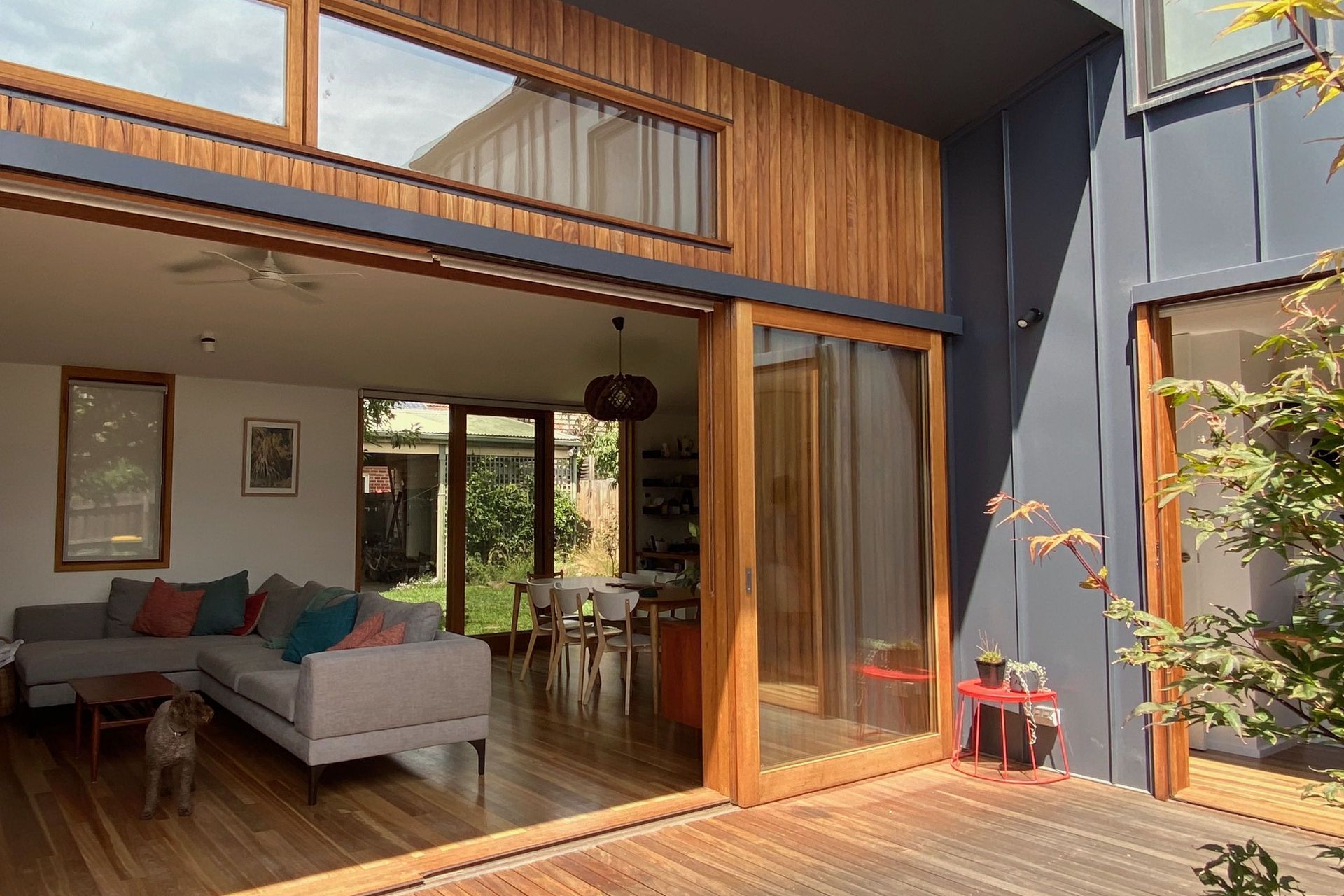 Fully opening sliding glass doors allow the living area to extend outside