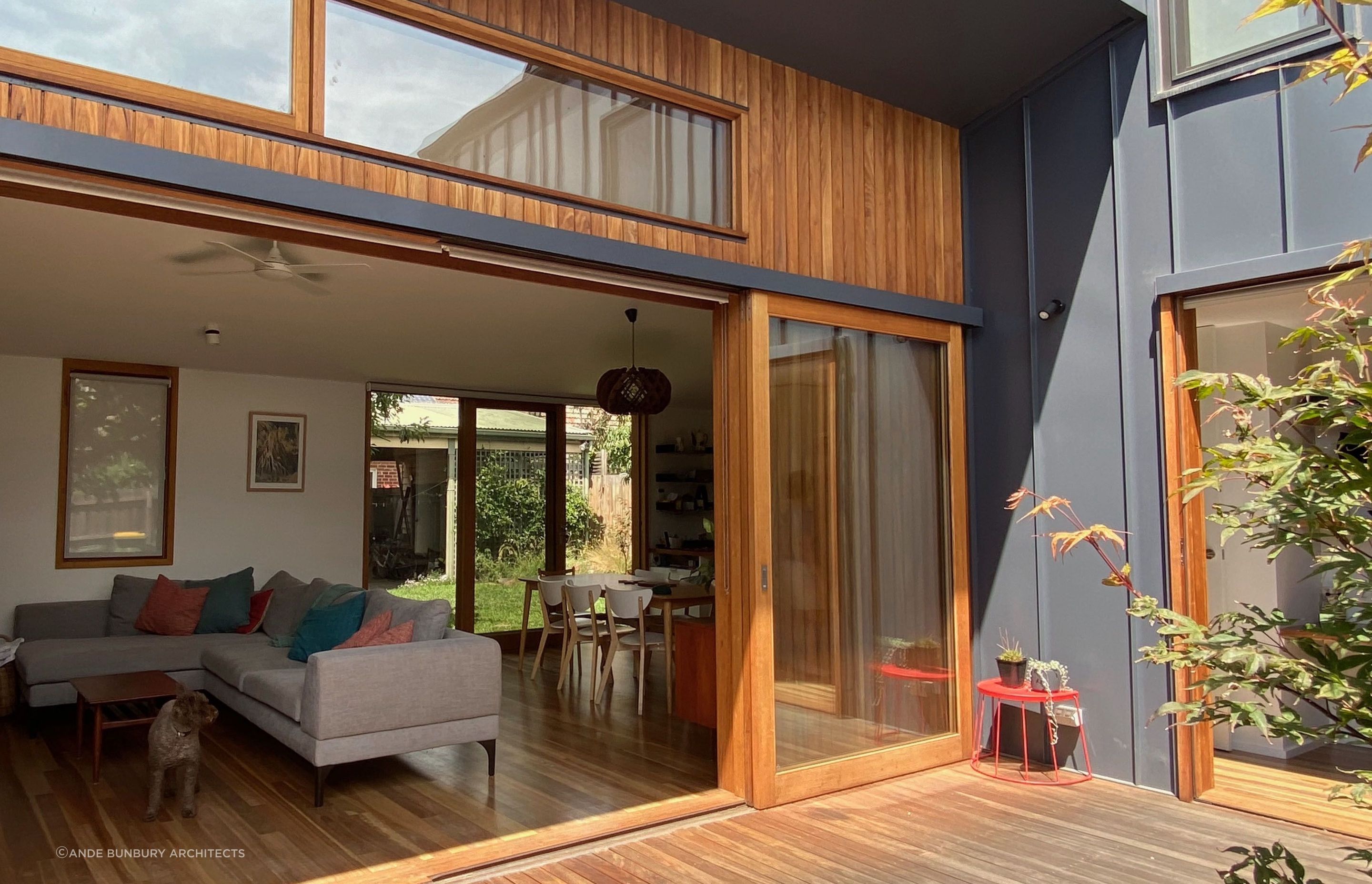 Fully opening sliding glass doors allow the living area to extend outside