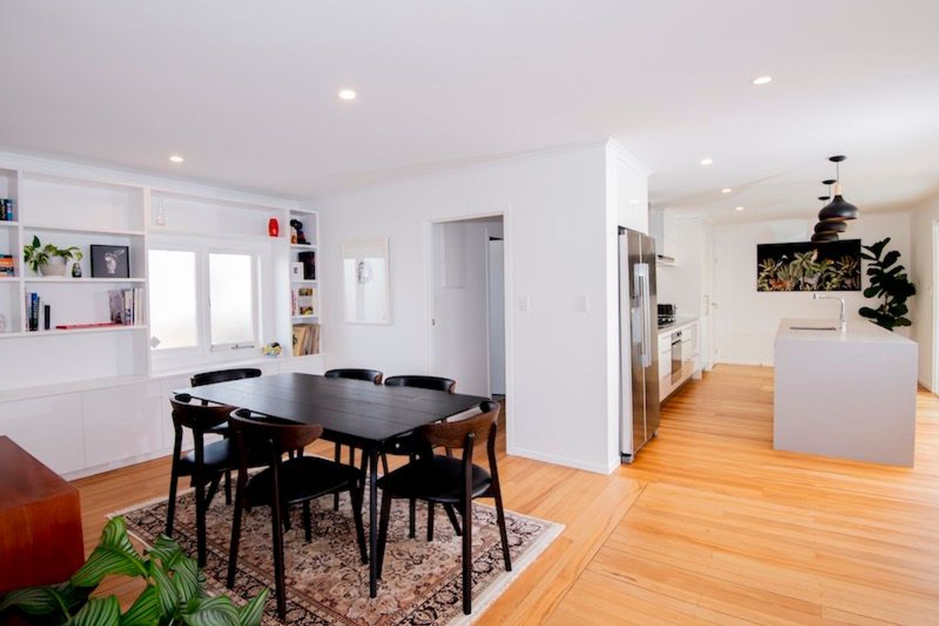 Removing the wall between the kitchen, dining and lounge created a brighter space.