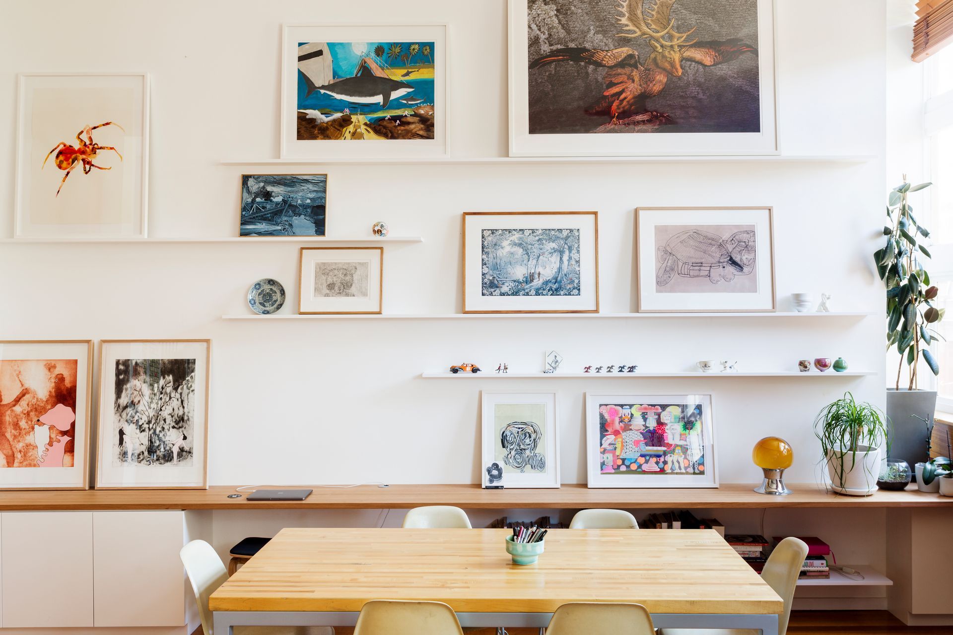 Floating shelves for framed artworks and small display objects