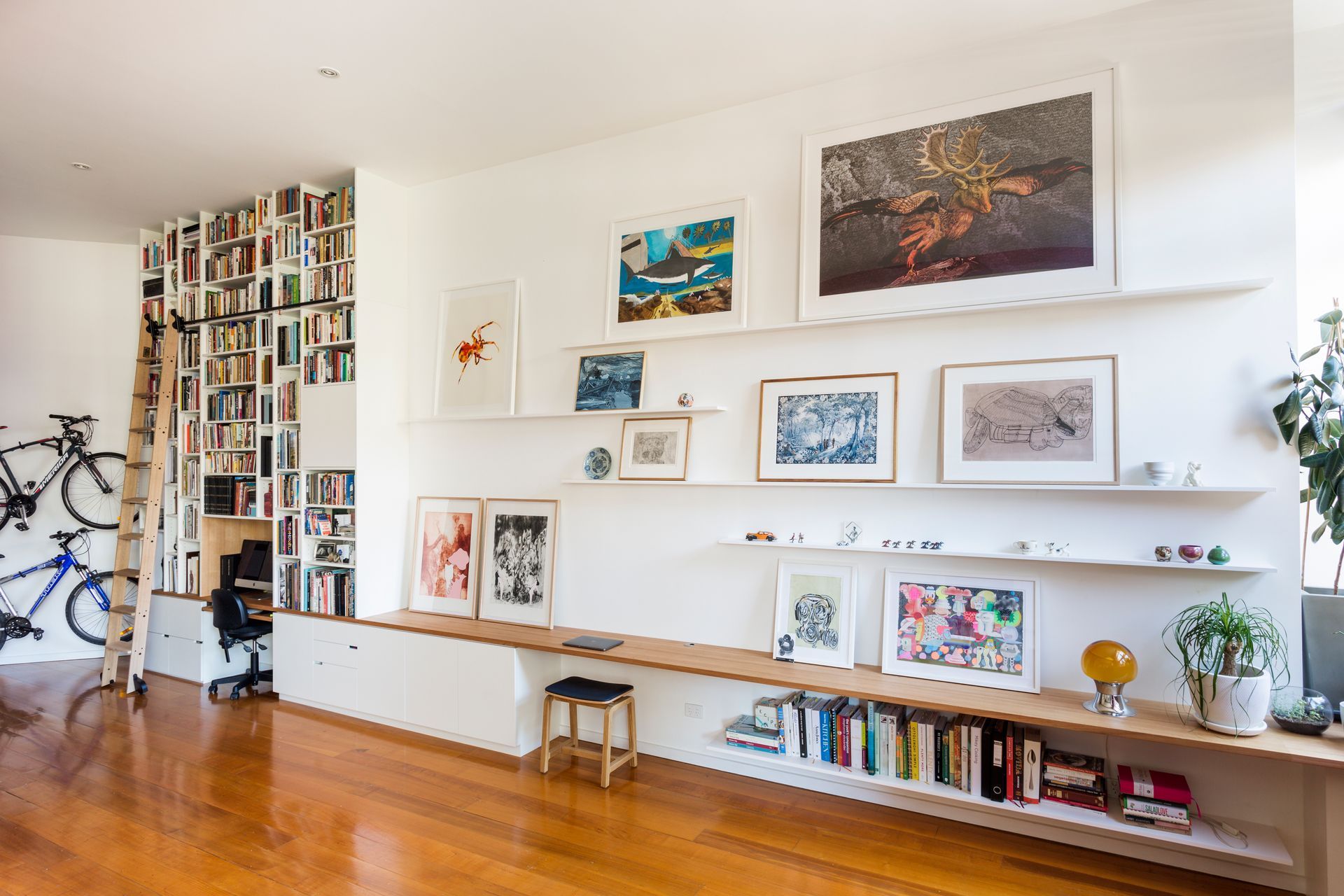 Vertical joinery in the library contracts with the horizontal joinery in the living area