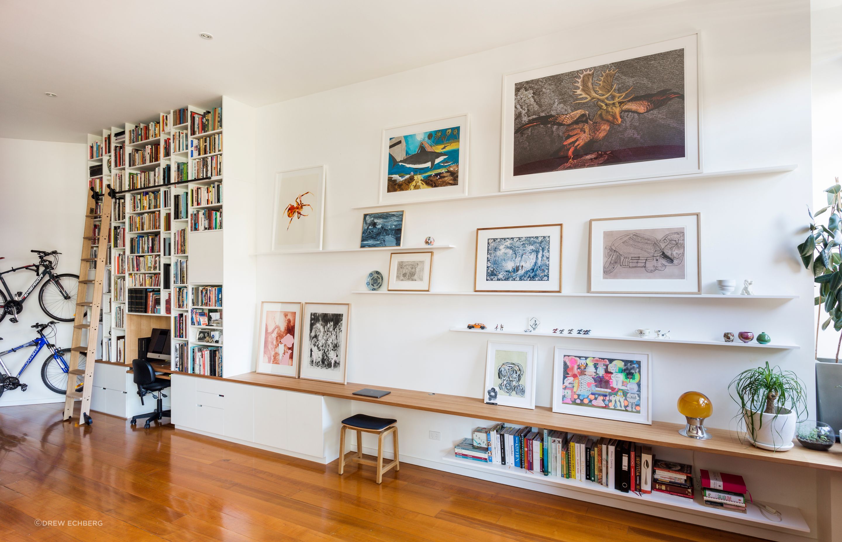 Vertical joinery in the library contracts with the horizontal joinery in the living area