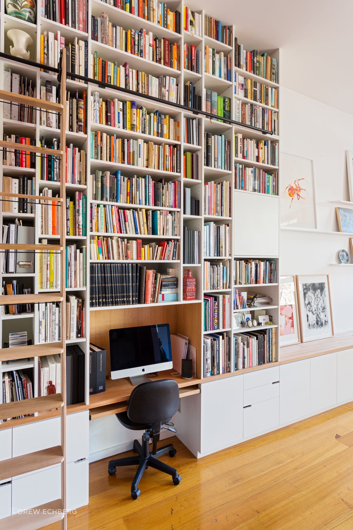 The library has a rolling ladder to access the books right up to the ceiling