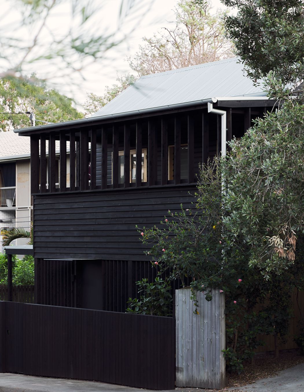 A rhythmic facade acts to mediate the house's relationship to the street, allowing various gradients of privacy, engagement, and views.