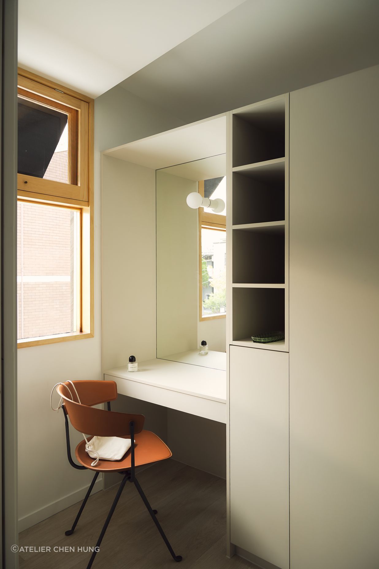 Part-height joinery elements act to define utility and sleeping spaces in the generous master bedroom suite.