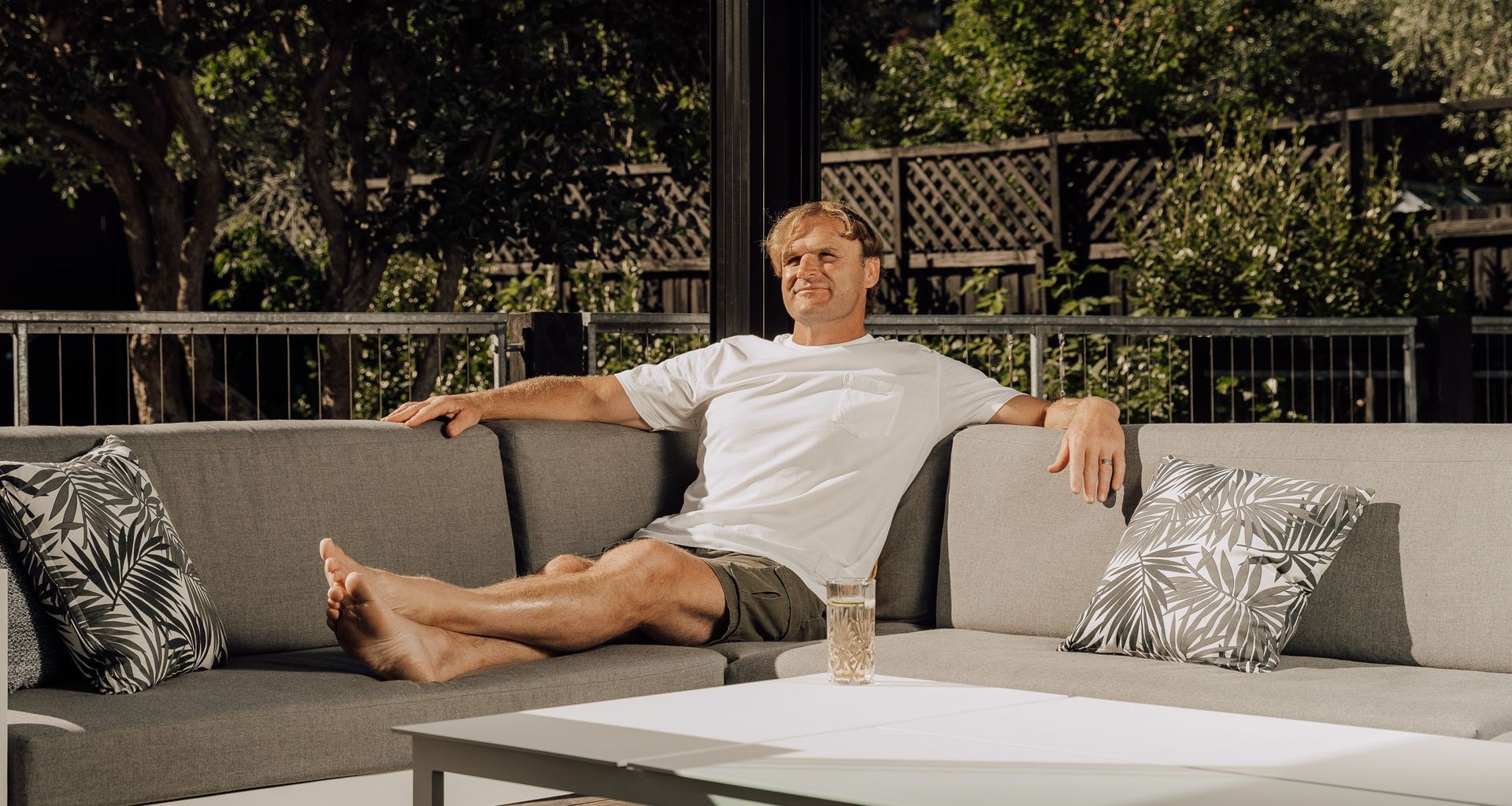 Razor Robertson and his Juralco Outdoor Living System banner