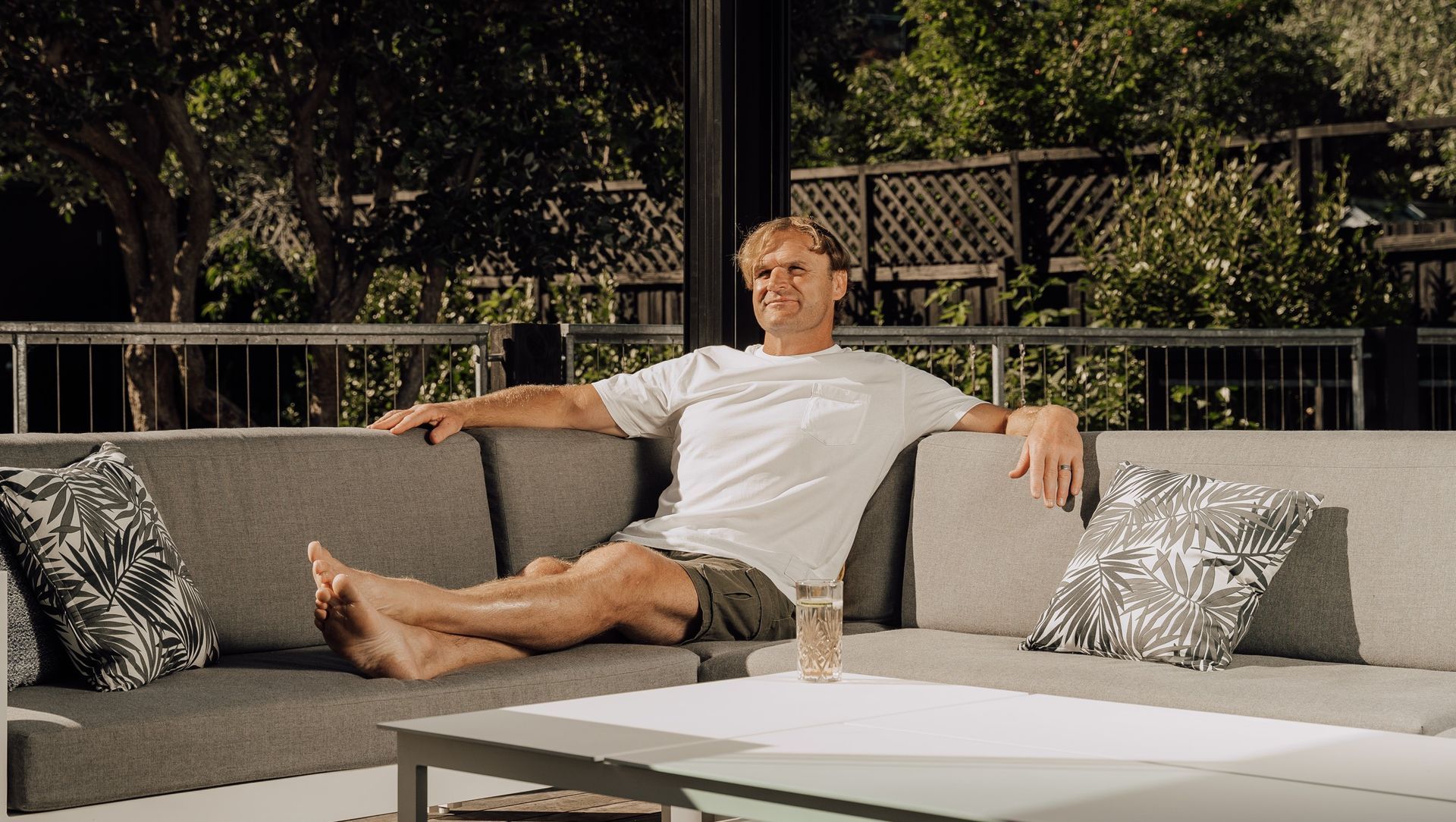 Razor Robertson and his Juralco Outdoor Living System banner
