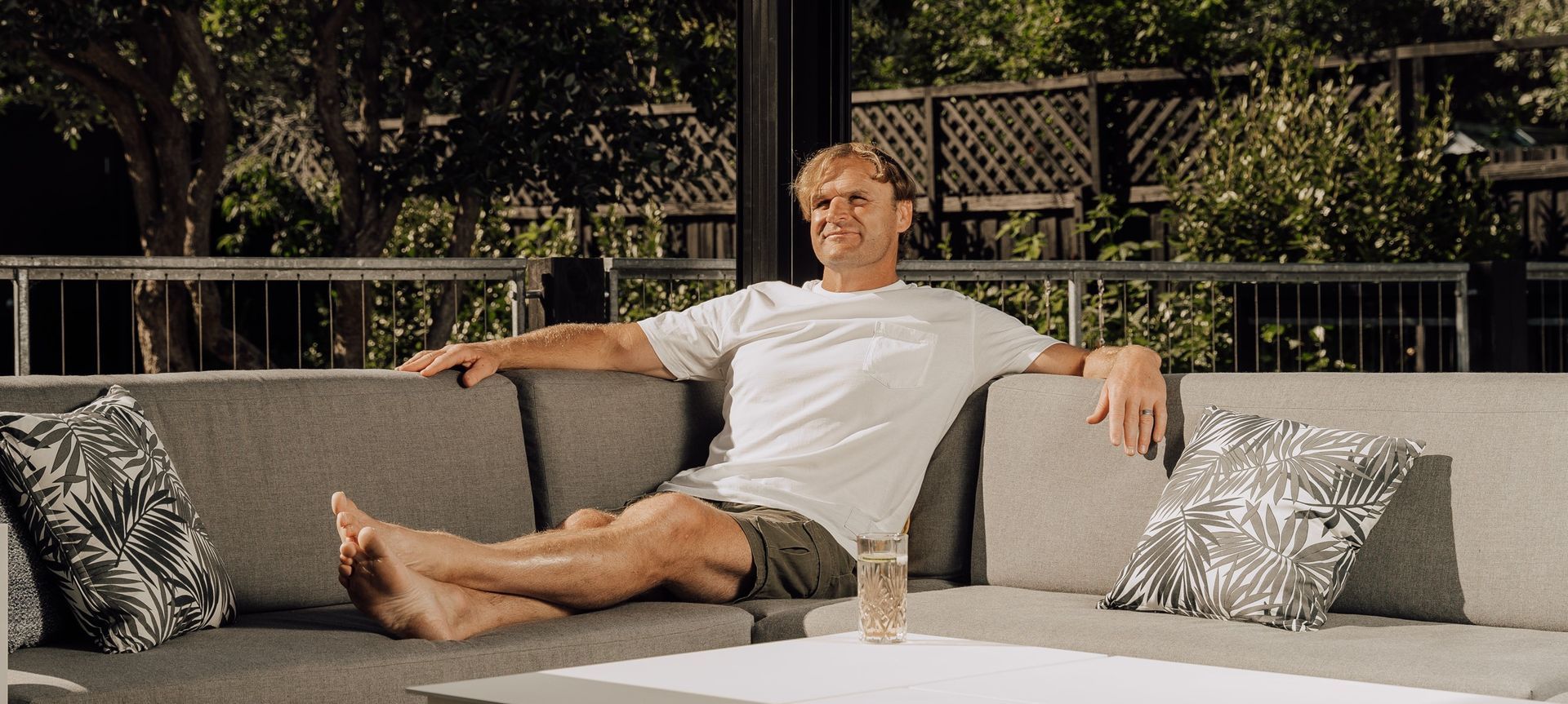 Razor Robertson and his Juralco Outdoor Living System banner