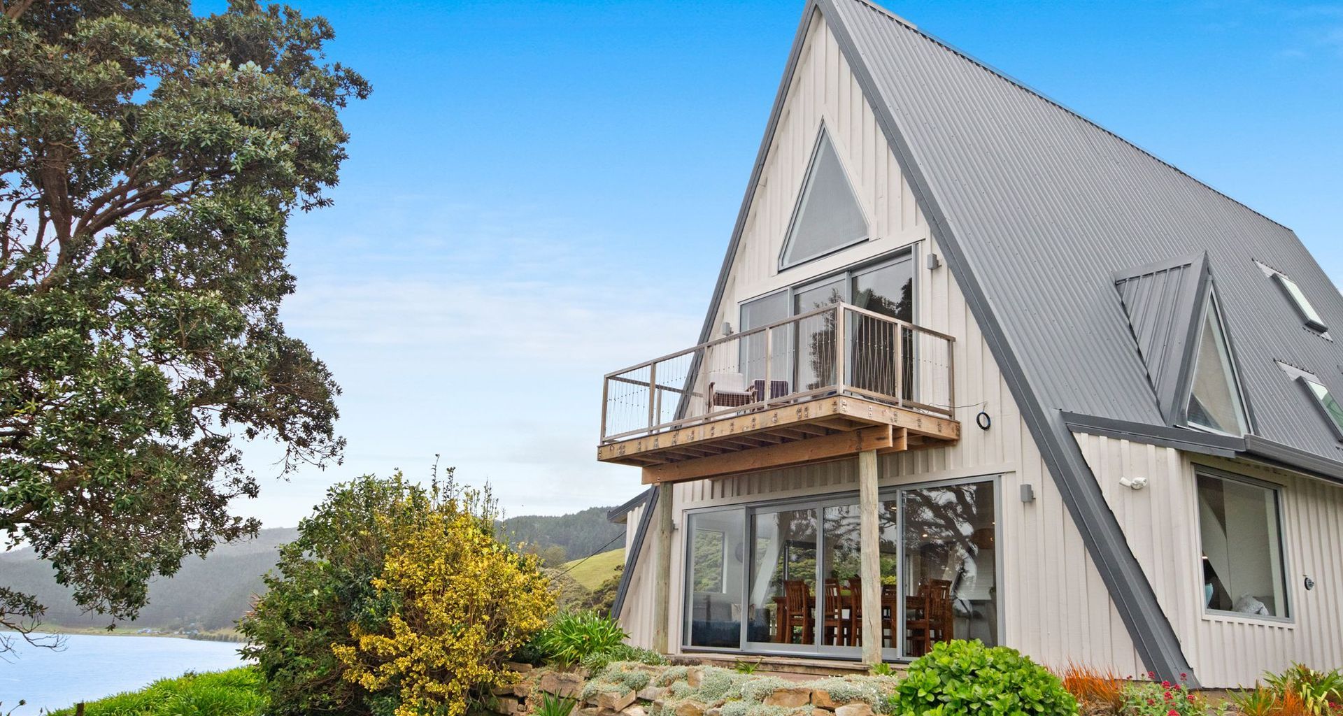 1970's A-Frame Bach Converted To Home In Port Waikato  banner
