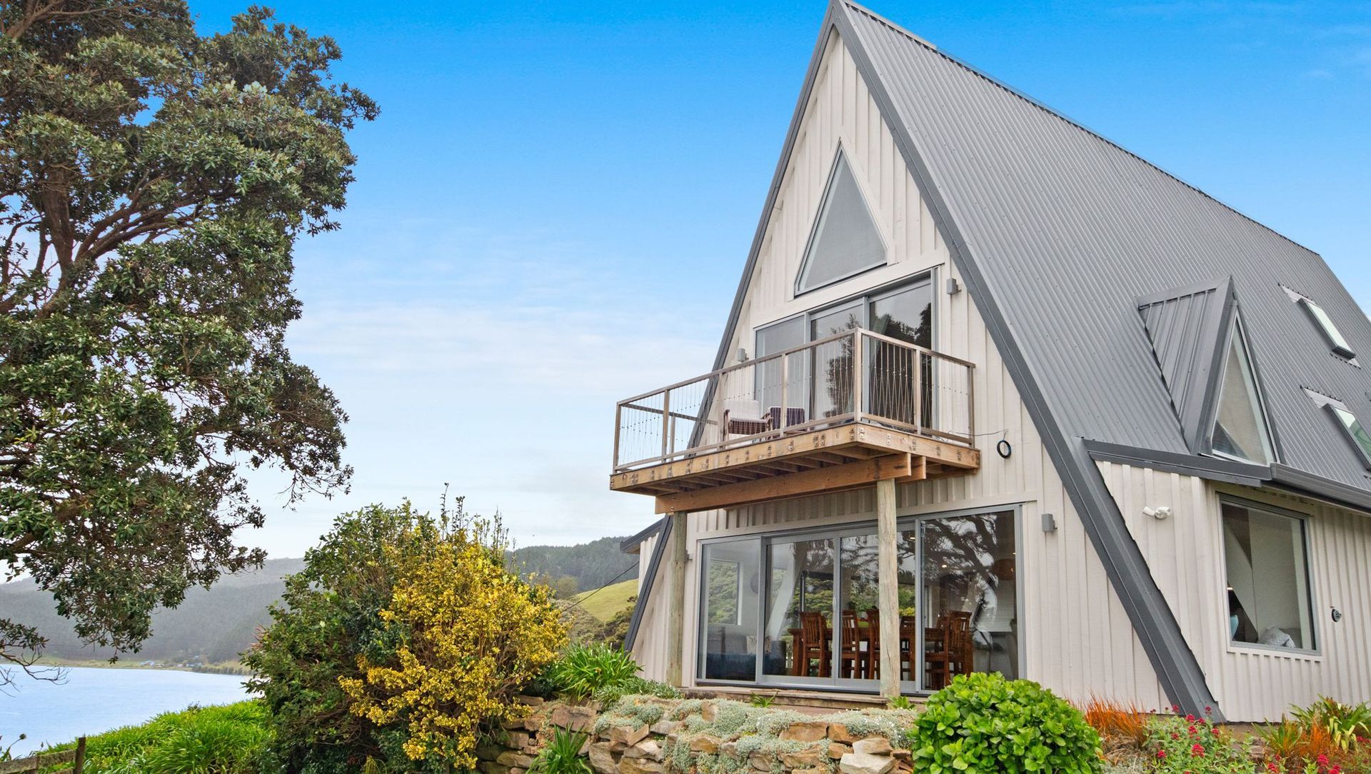 1970's A-Frame Bach Converted To Home In Port Waikato  banner