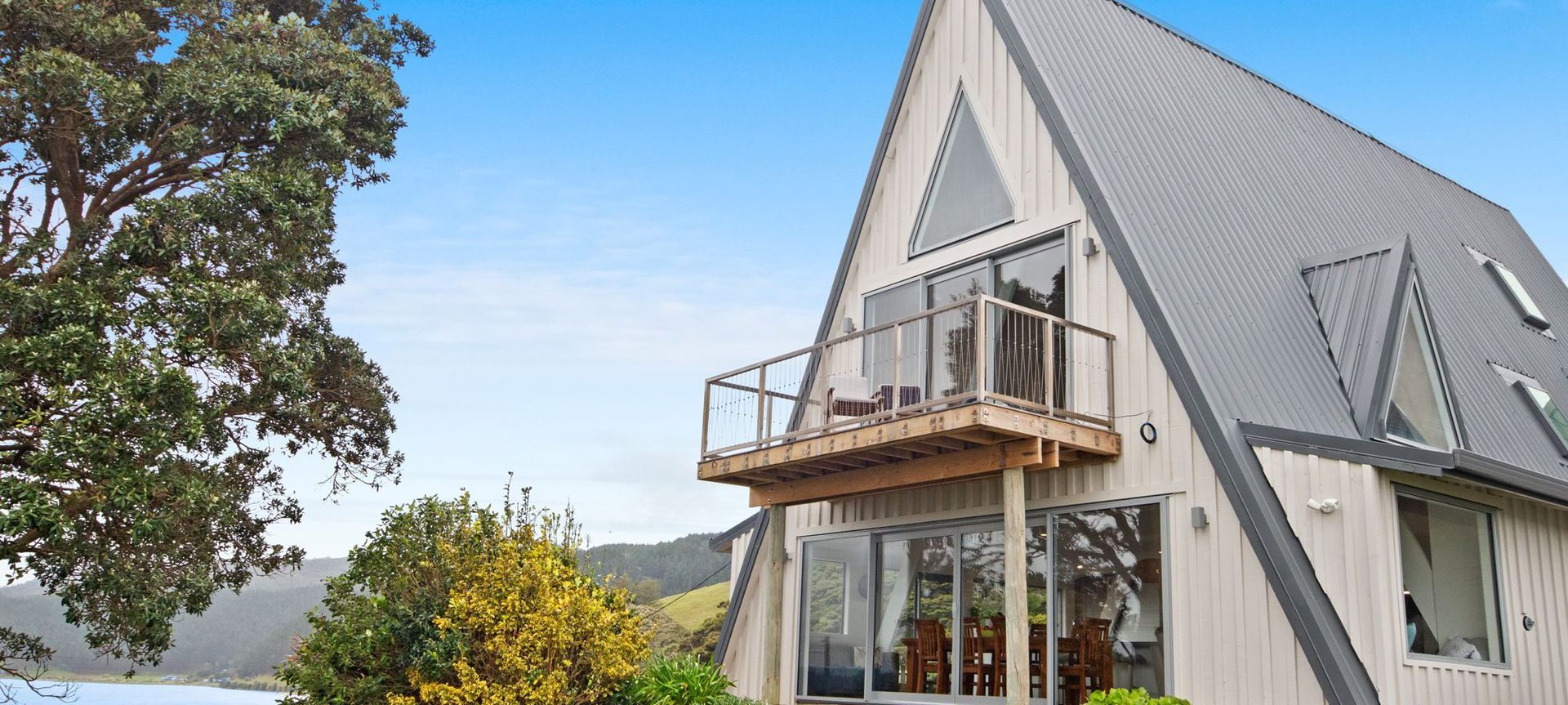 1970's A-Frame Bach Converted To Home In Port Waikato  banner