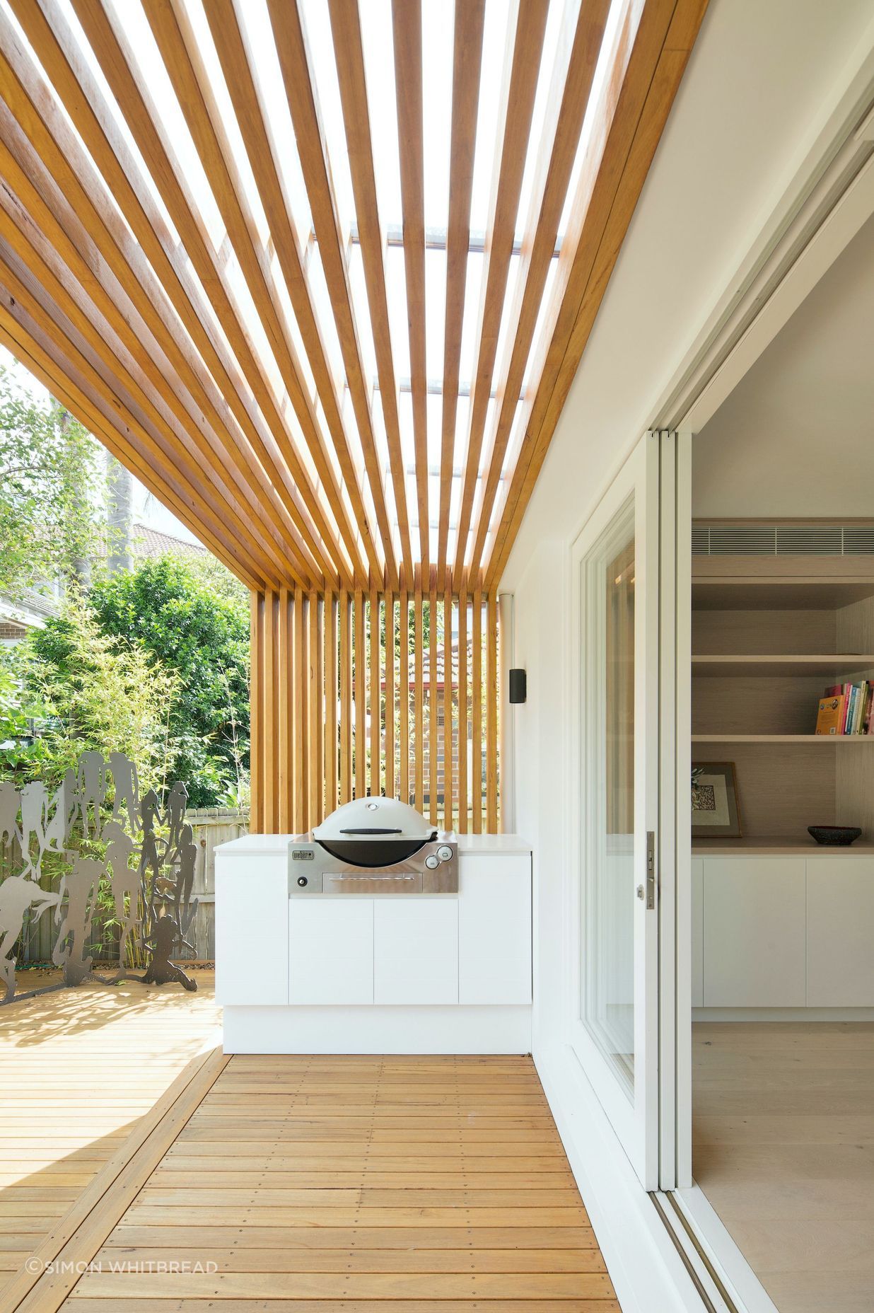 The rear verandah becomes an extension of the interior with continued joinery and timber linings.
