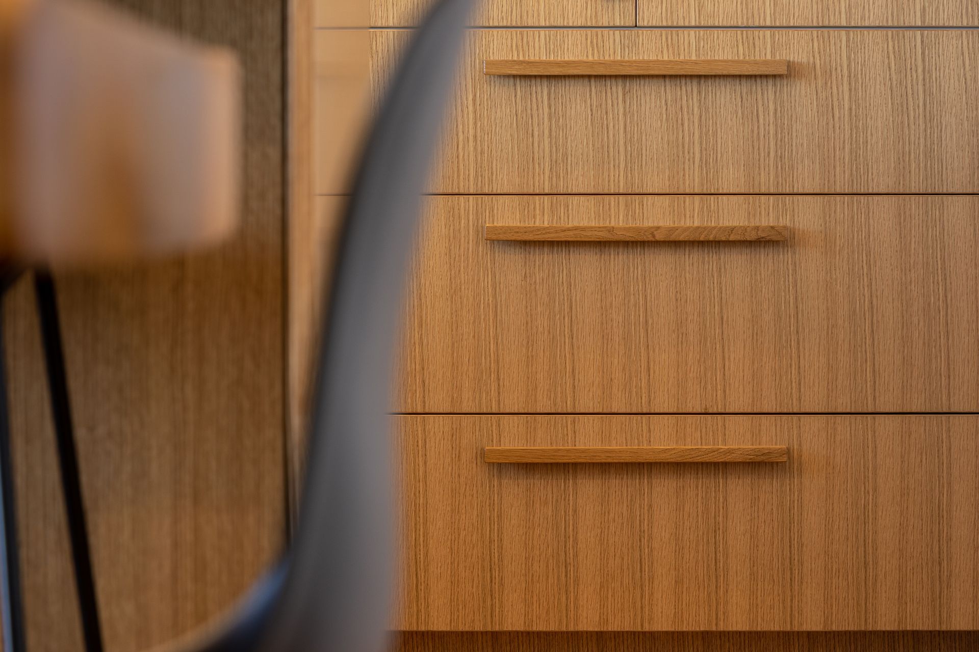 Custom made handles on Client's design - Solid Timber Clear Stained to match Fronts in Veneer