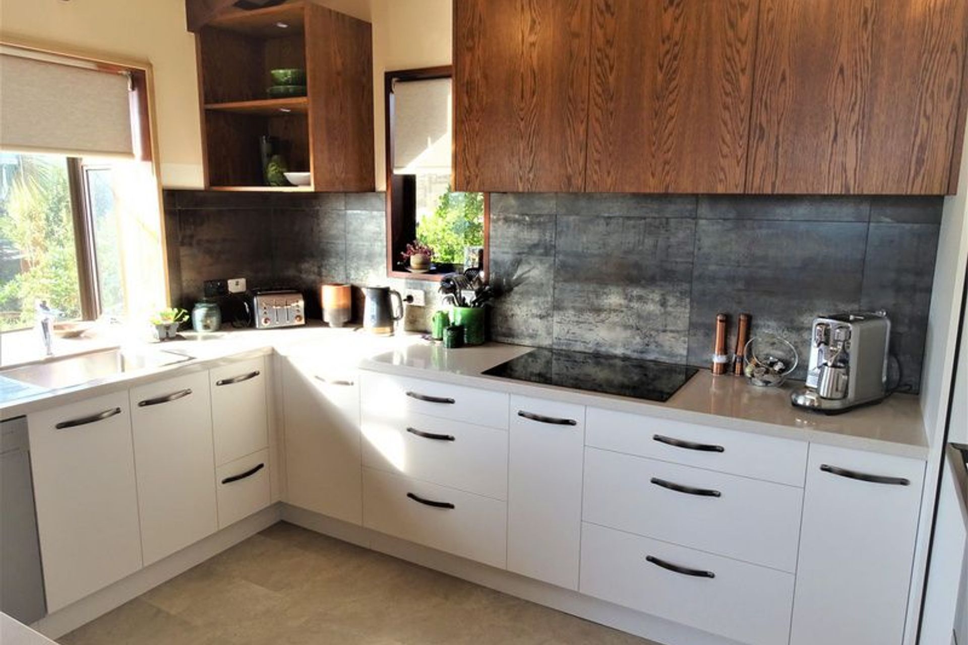 The kitchen joinery from the storage to the window and ceiling joists all ties together