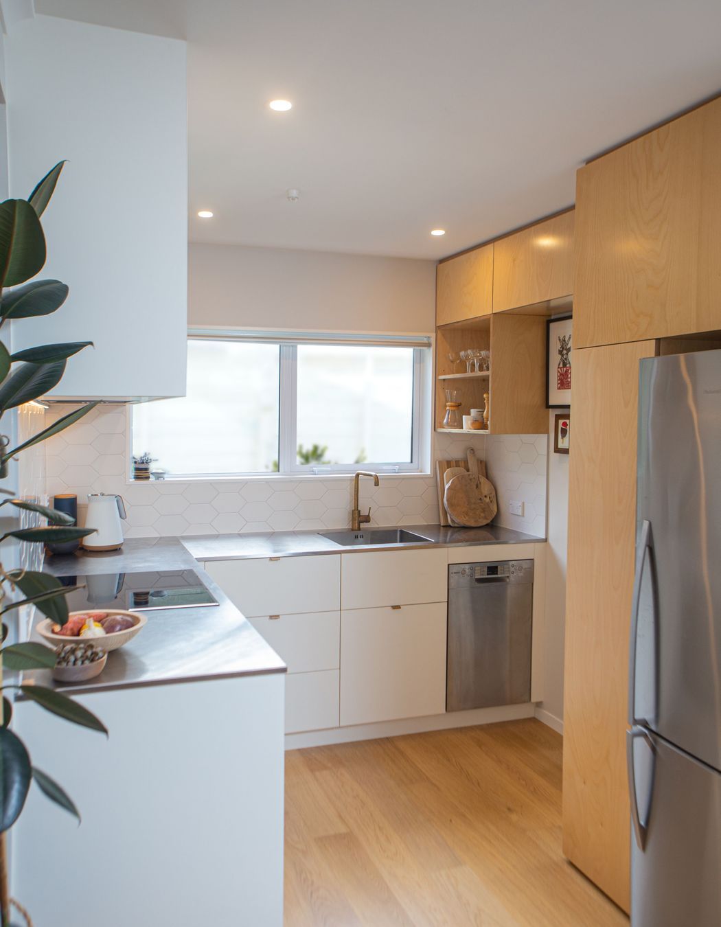 Tucked away through a cavity slider to the right is the laundry / scullery and a second toilet.