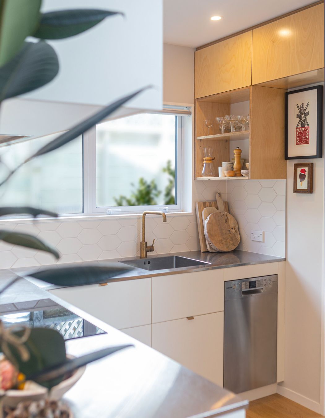 Functional kitchen in a small space, with ample working triangle and small appliances.