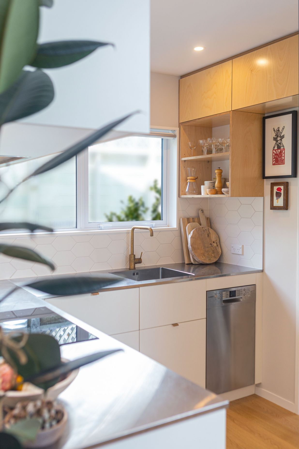 Functional kitchen in a small space, with ample working triangle and small appliances.
