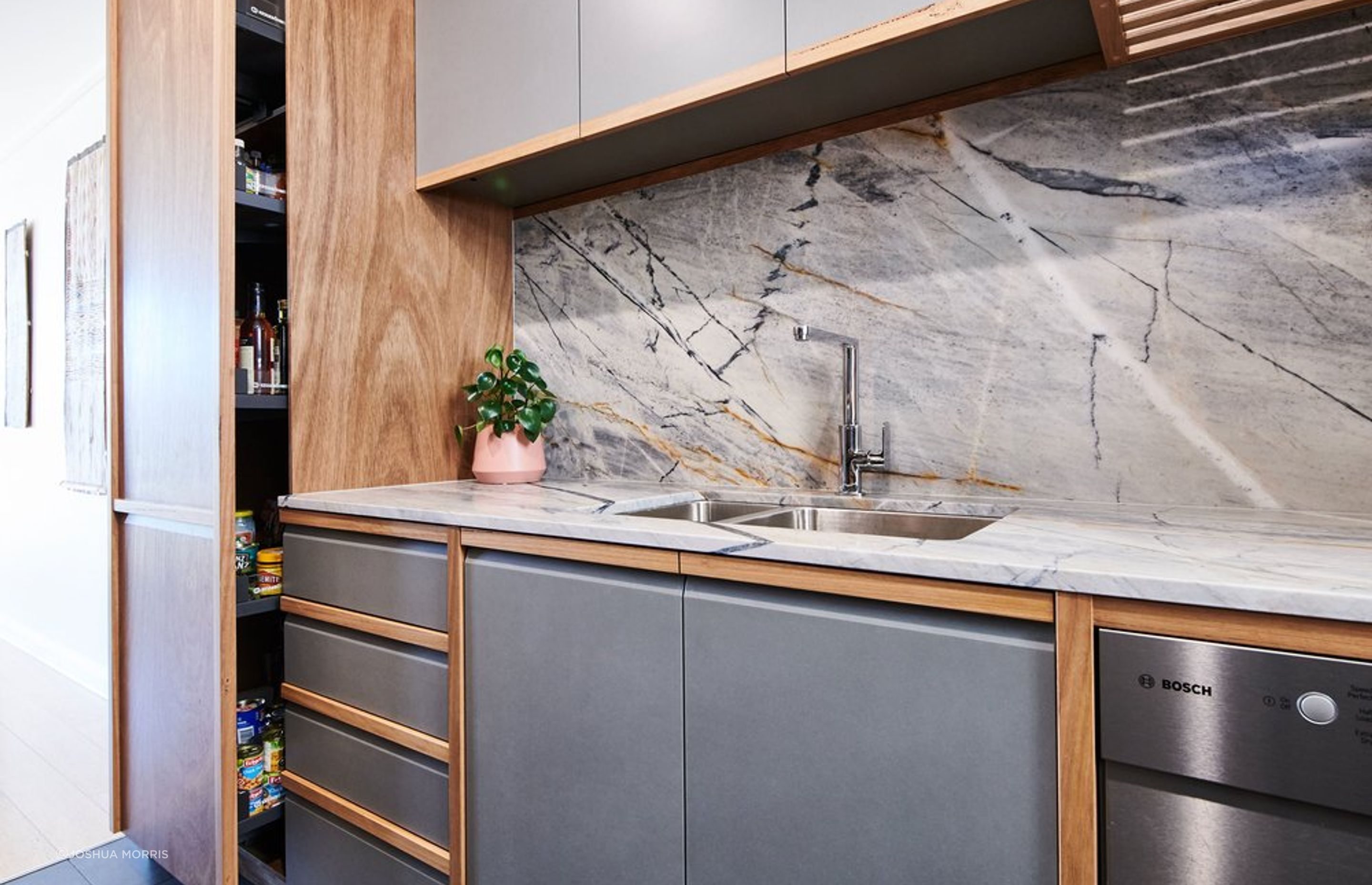 Solid Blackbutt handles and vertical partitions are a contemporary take on traditional frame and panel doors.