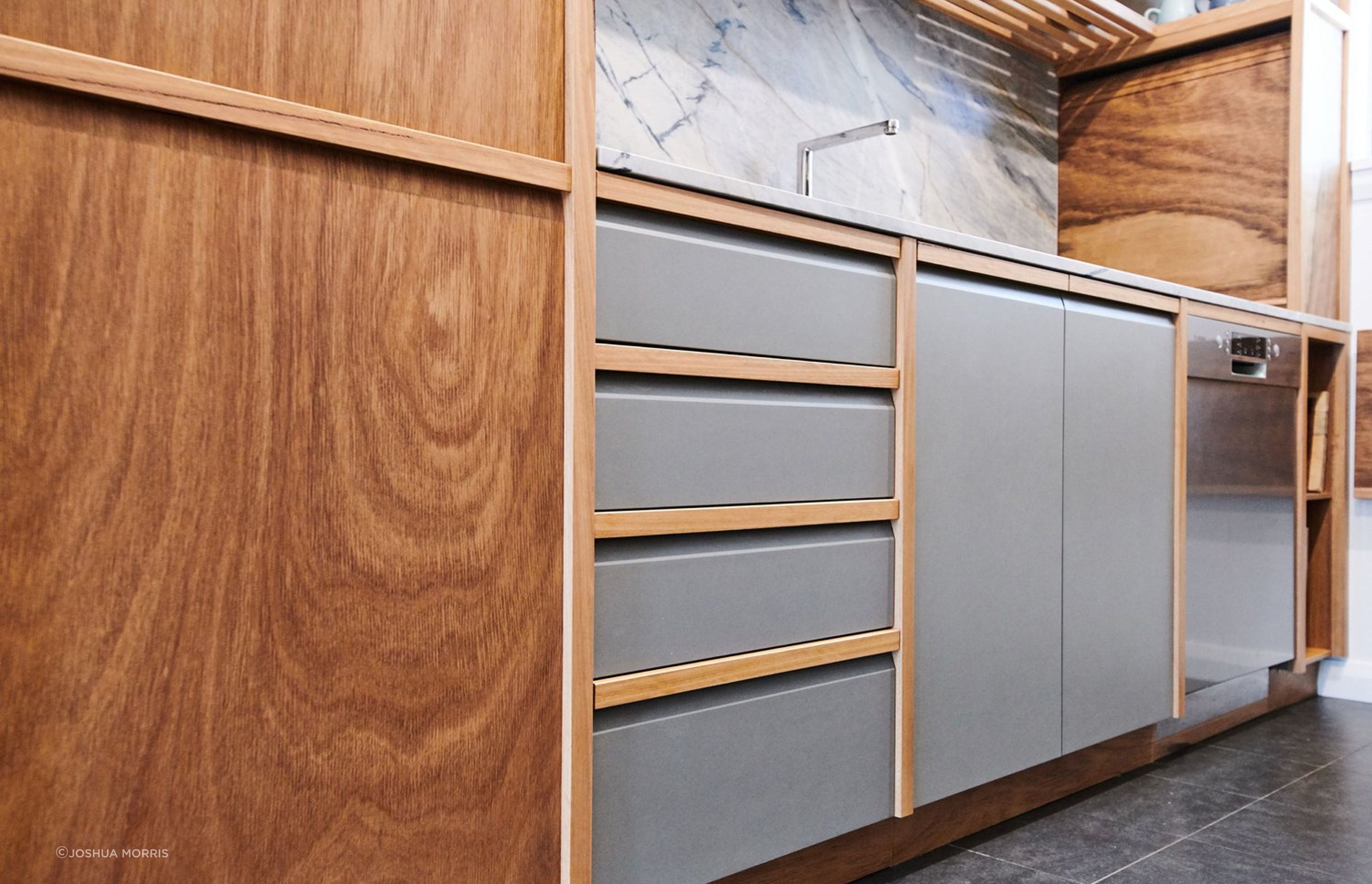 Our handle design cuts into the face on a taper, enabling a larger finger-pull and play of light on the surface.