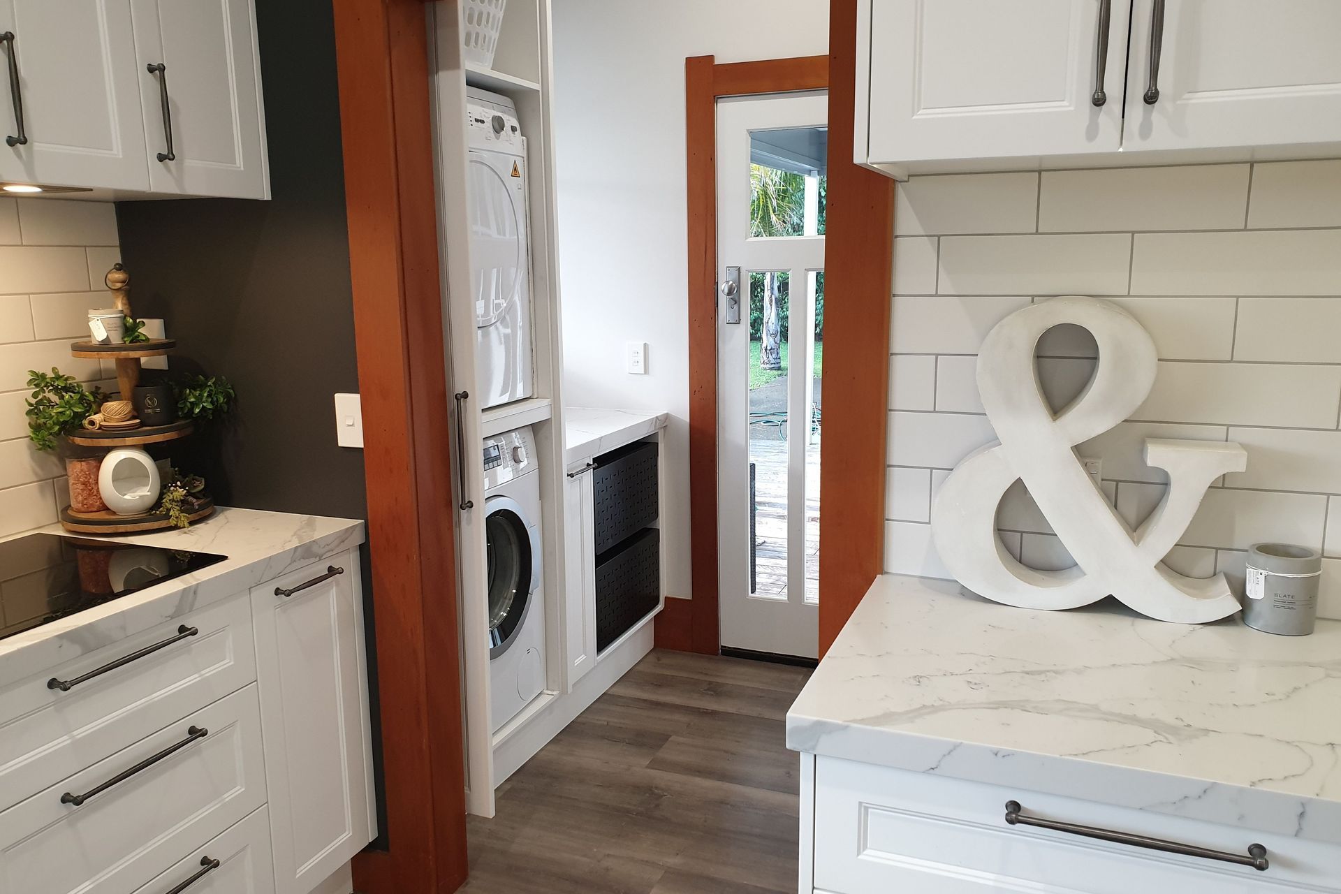 Salice Pocket Door Used to Create an Efficient Laundry Appliance Cupboard - Seen Here with Door Open (Closed in Previous Photo)