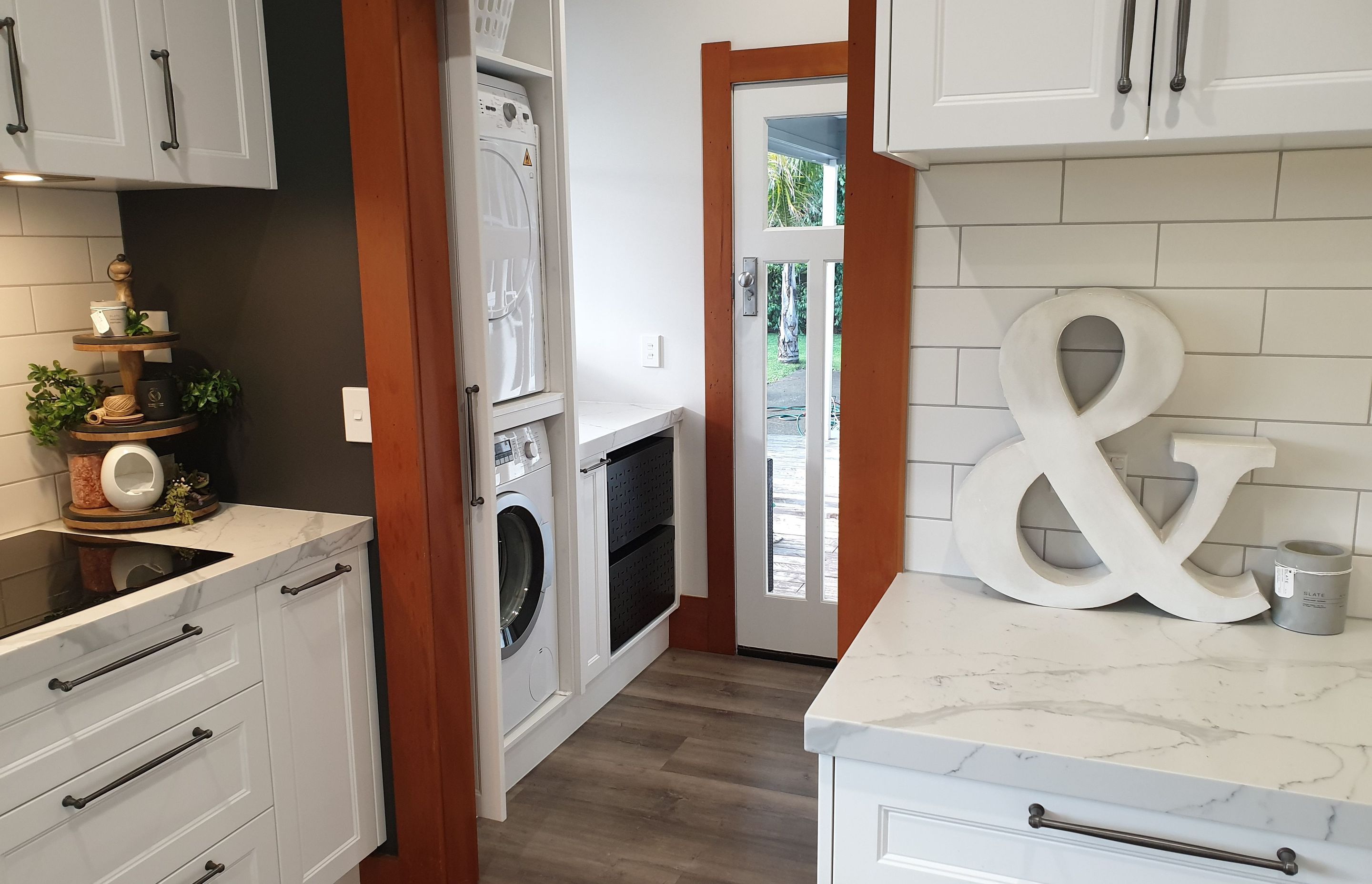 Salice Pocket Door Used to Create an Efficient Laundry Appliance Cupboard - Seen Here with Door Open (Closed in Previous Photo)