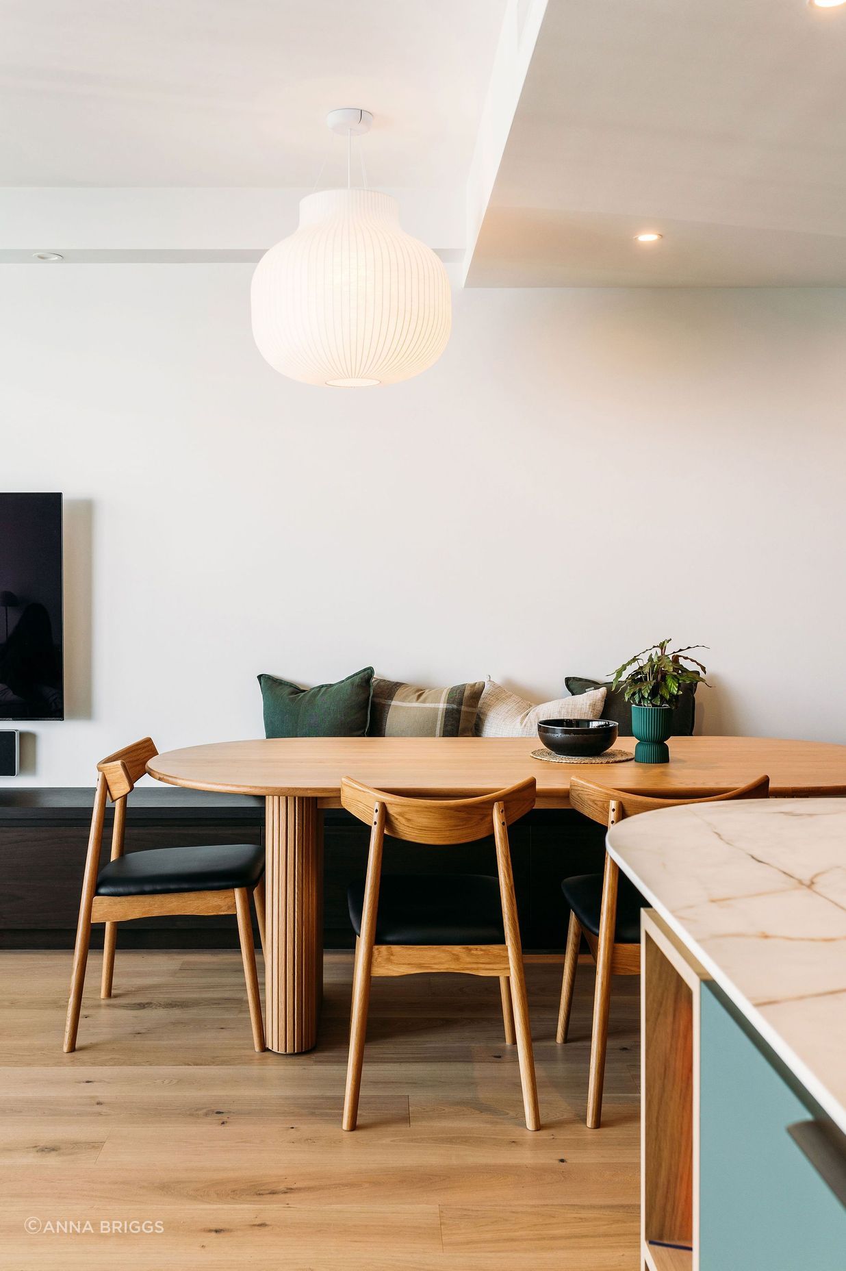 The pendant perfectly hangs in sight line from the bedrooms, and over the dining table.