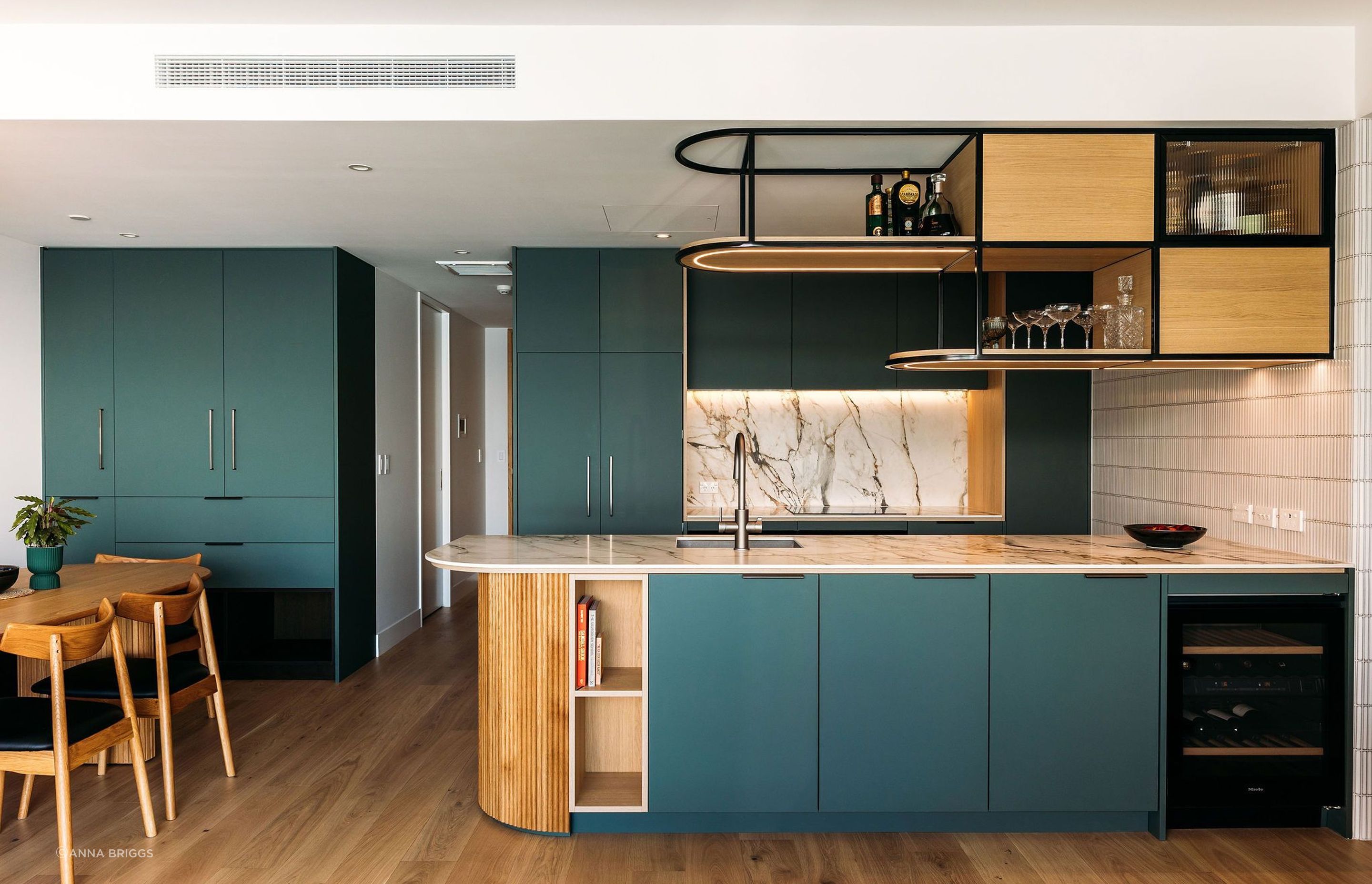 Reflecting the changing hues of the sea, this kitchen sits proud in the waterfront apartment.