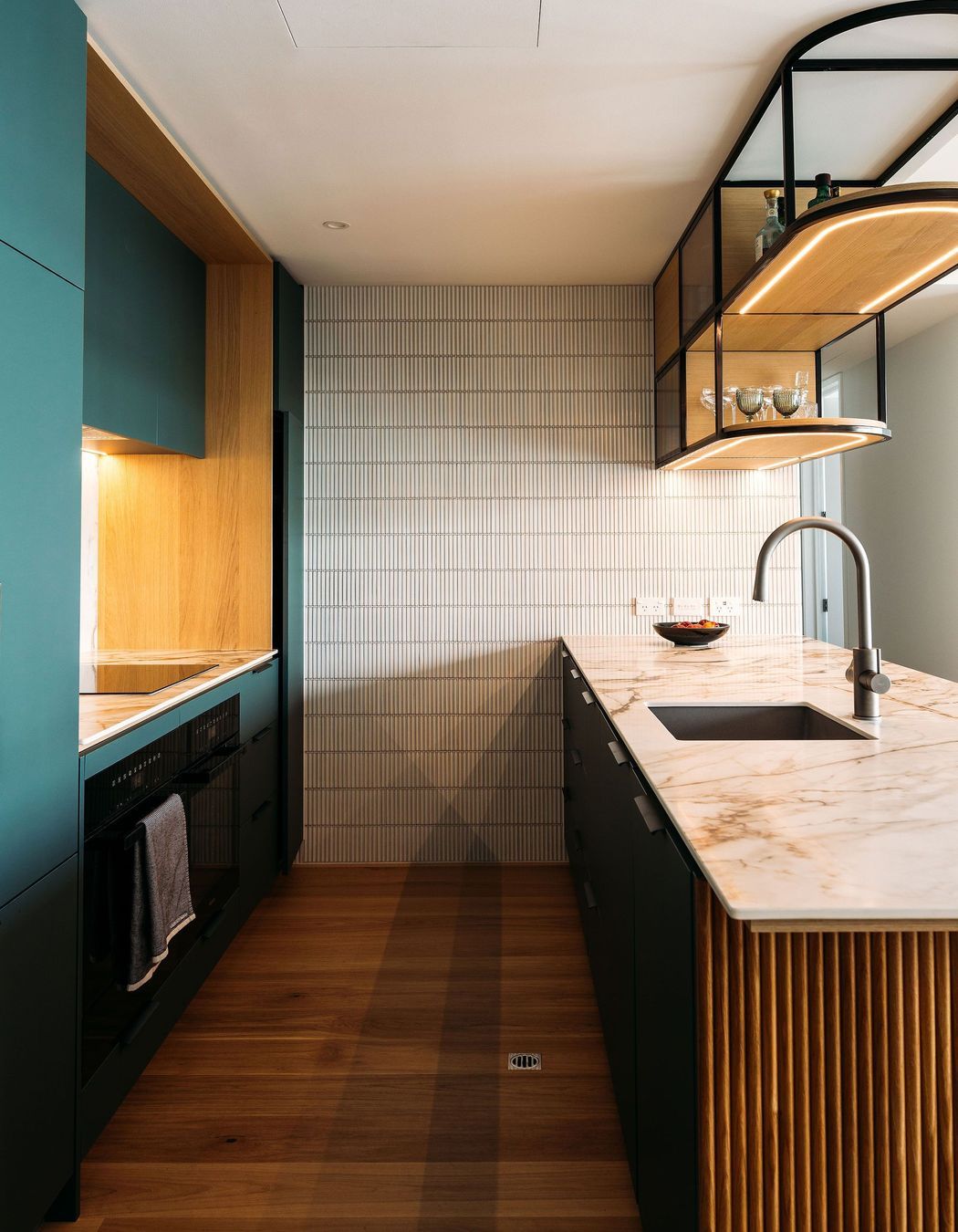 Turning this kitchen into a galley has allow for more storage and a functional workspace for two or more people.