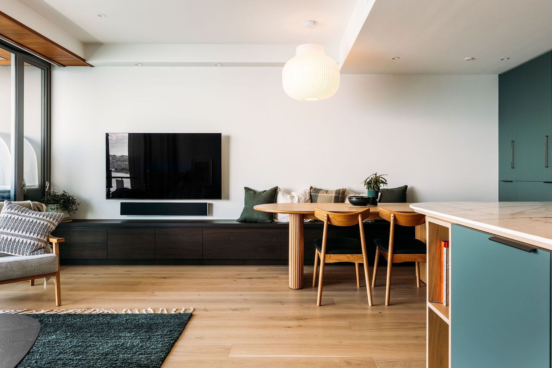 The bench seat cabinetry houses drawers the full length of the room.