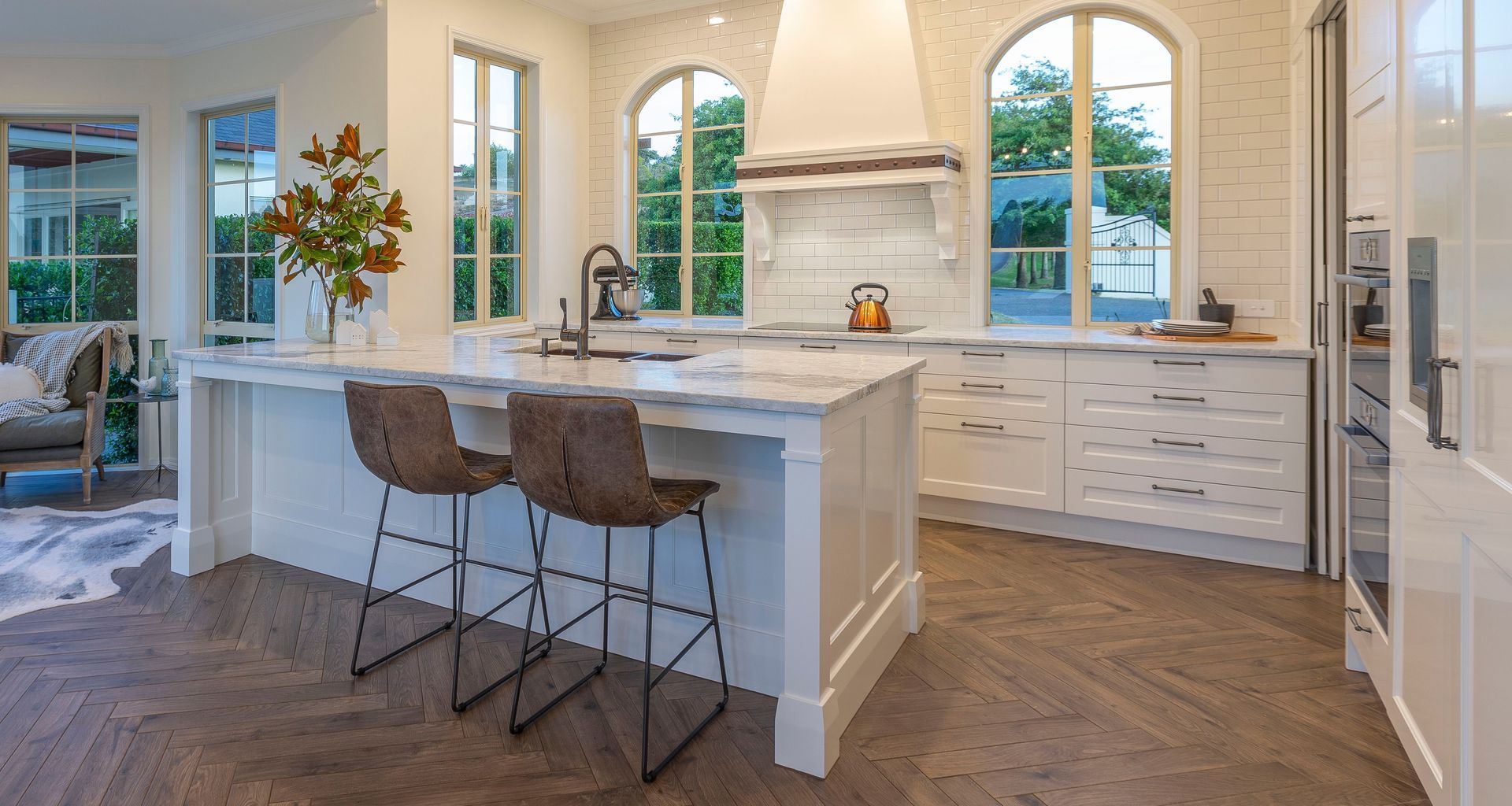 A dramatically transformed kitchen befitting of its grand French-country architecture.